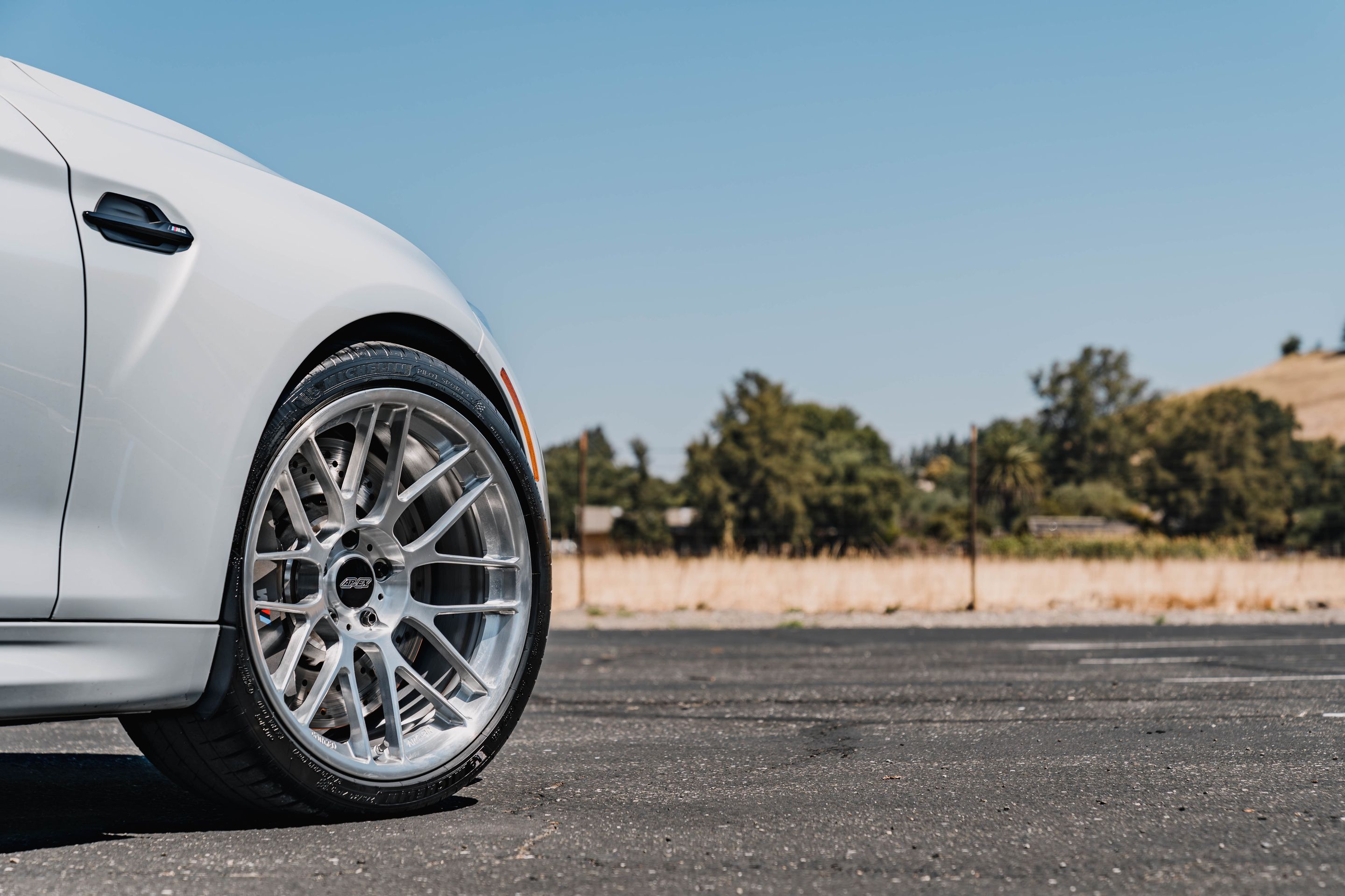 Silver BMW F87 M2 with 19" ARC-8RT Apex wheels in Brushed Clear