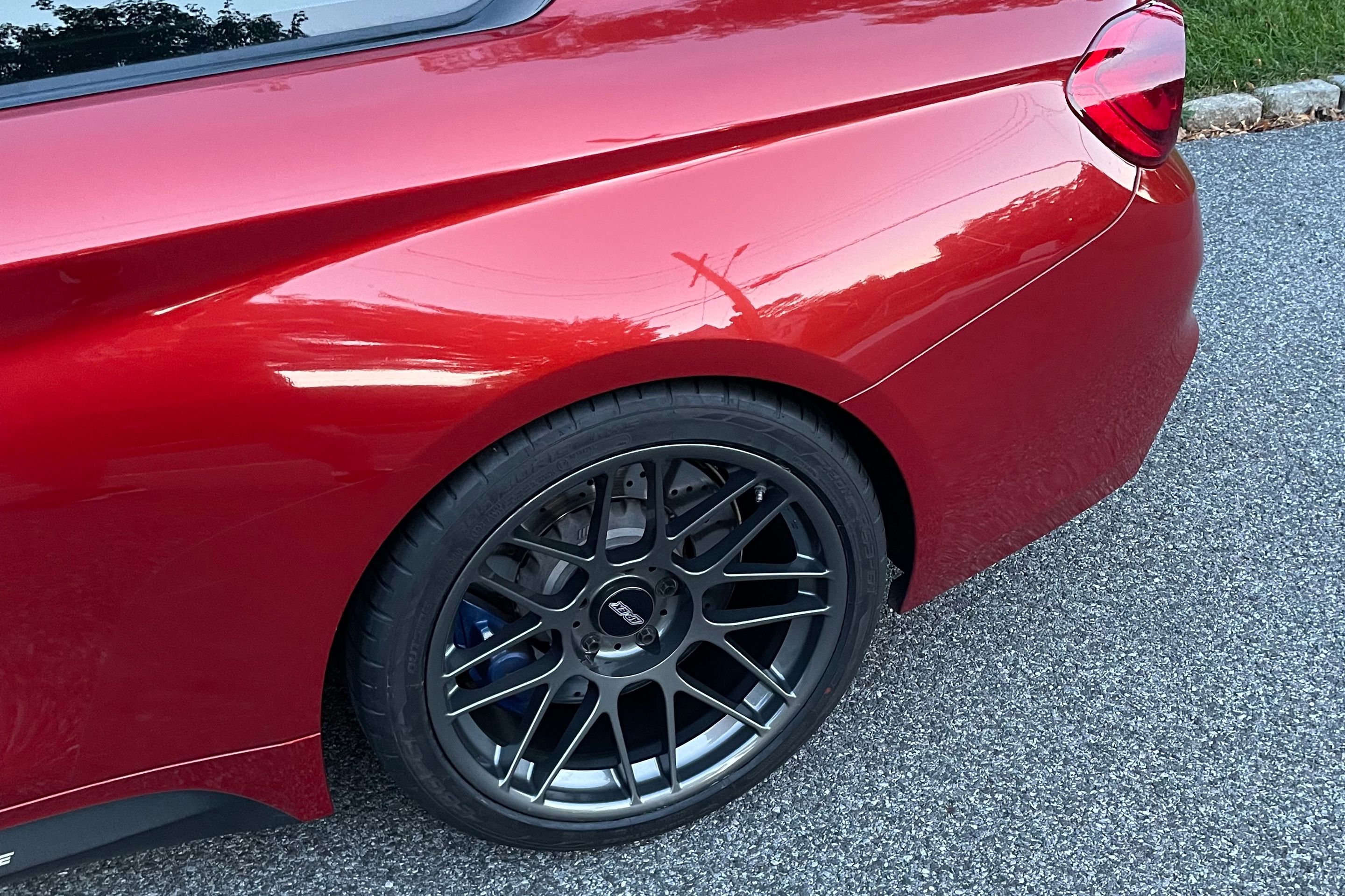 Red BMW F82 Coupe M4 with 19" ARC-8 Apex wheels in Anthracite