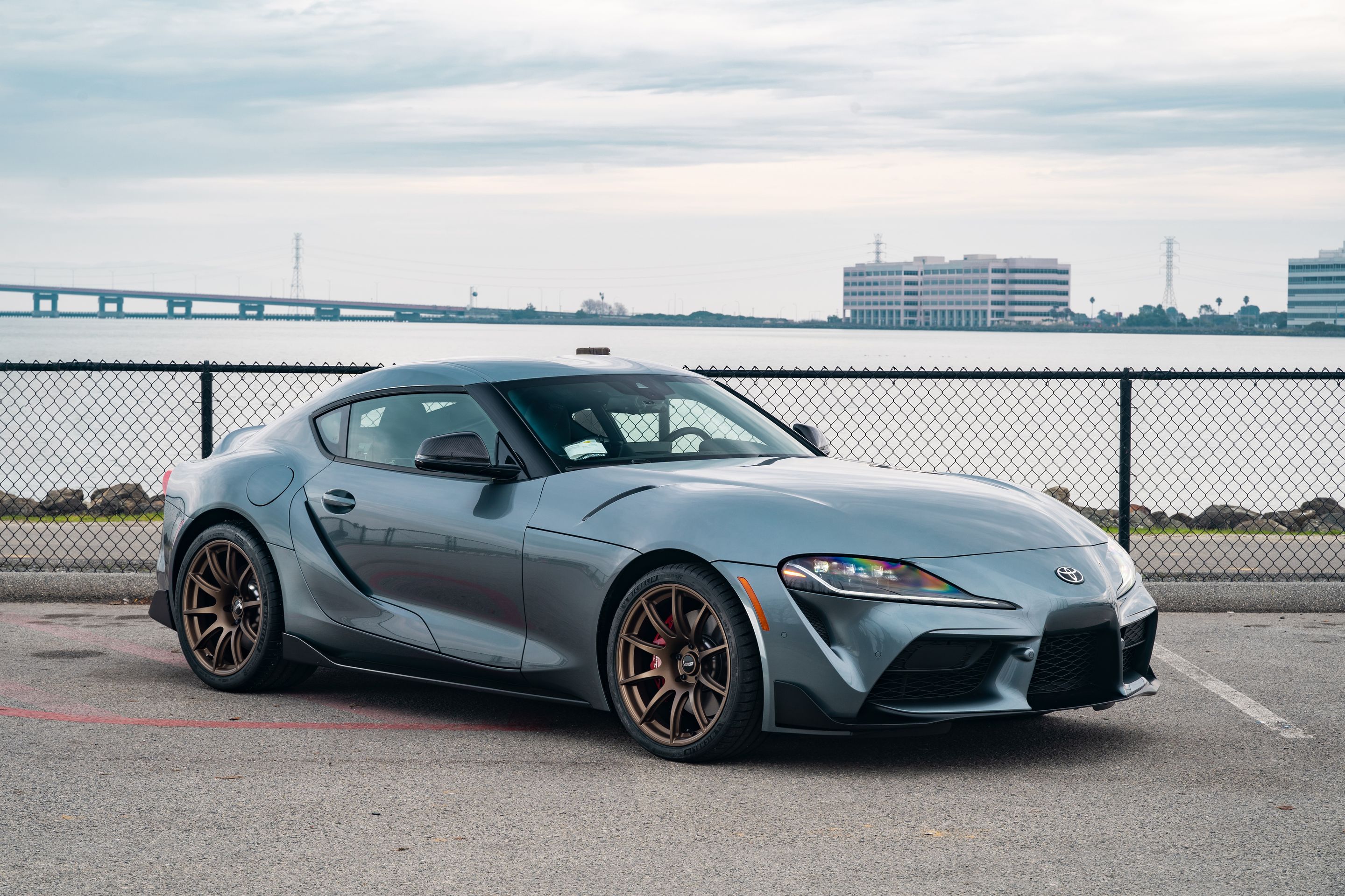 Grey Toyota GR Supra with 19" SM-10 Apex wheels in Satin Bronze