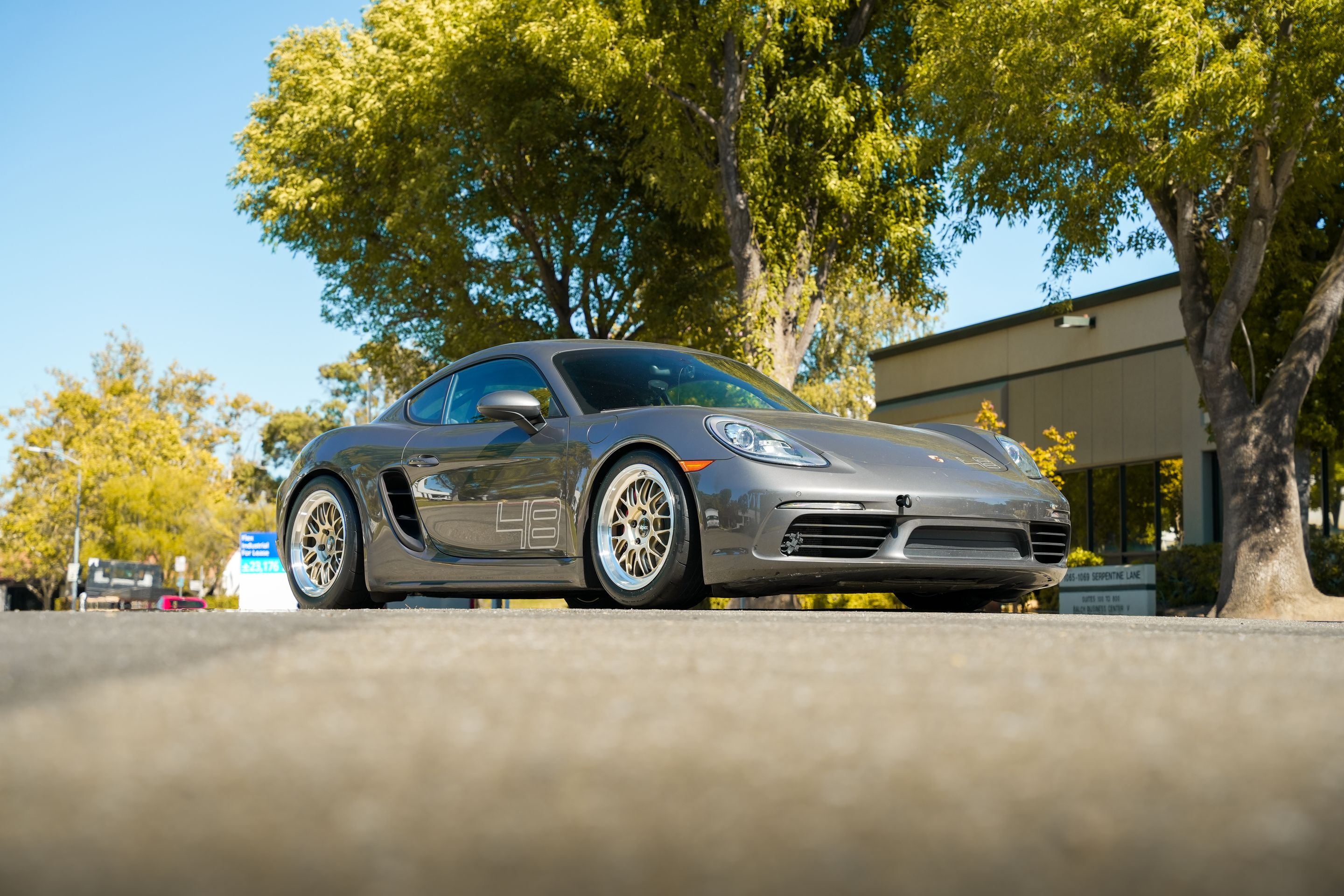 Grey Porsche 718 Cayman S with 18" ML-10RT Apex wheels in Machined Lip Gloss Motorsport Gold