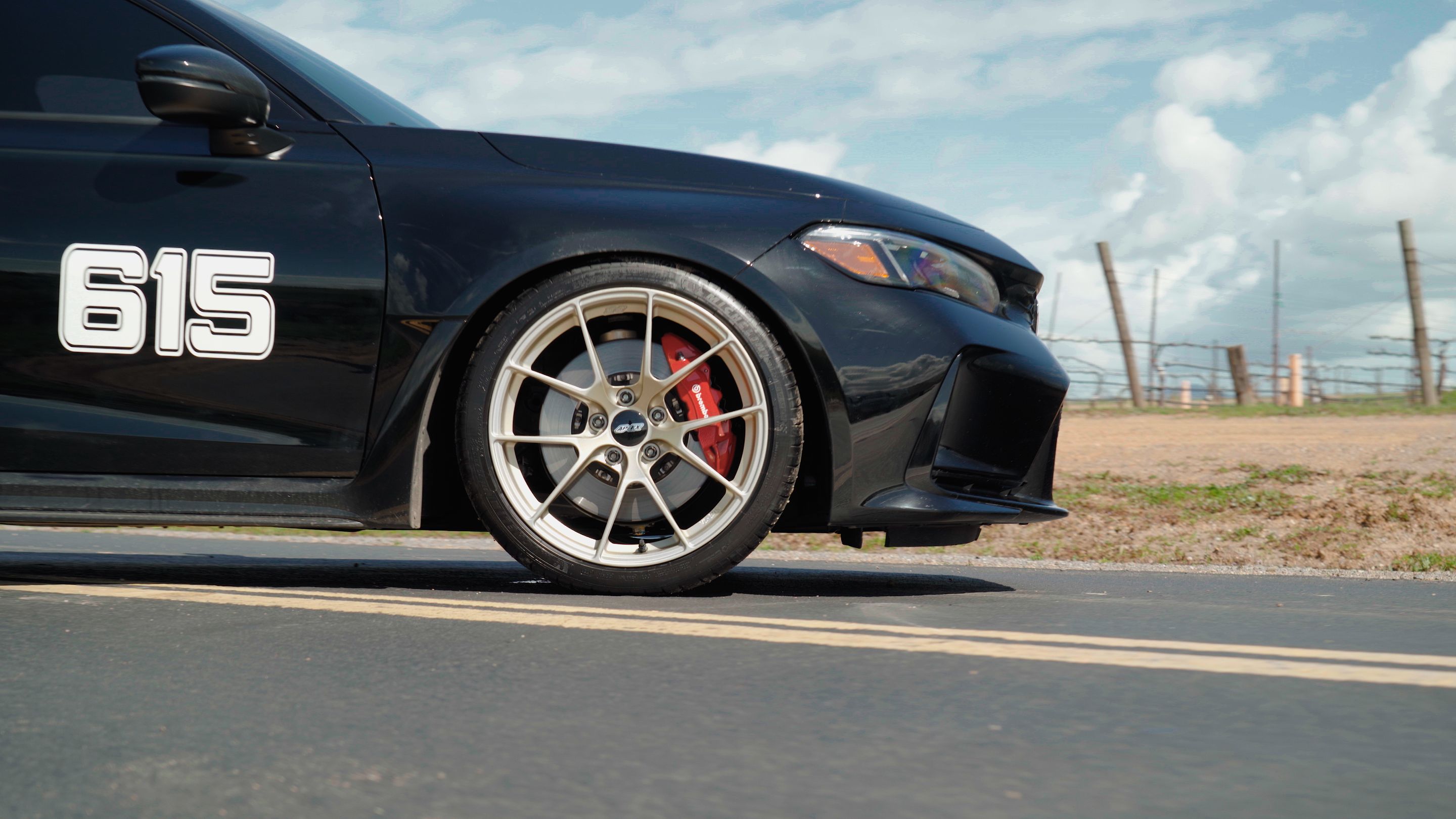 Black Honda FL5 Civic Type-R with 19" VS-5RS Apex wheels in Motorsport Gold
