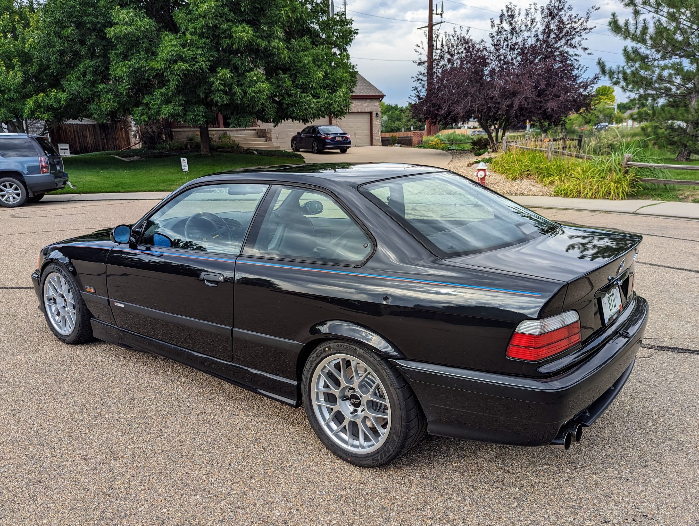 Black BMW E36 M3 with 17" ARC-8 Apex wheels in Hyper Silver