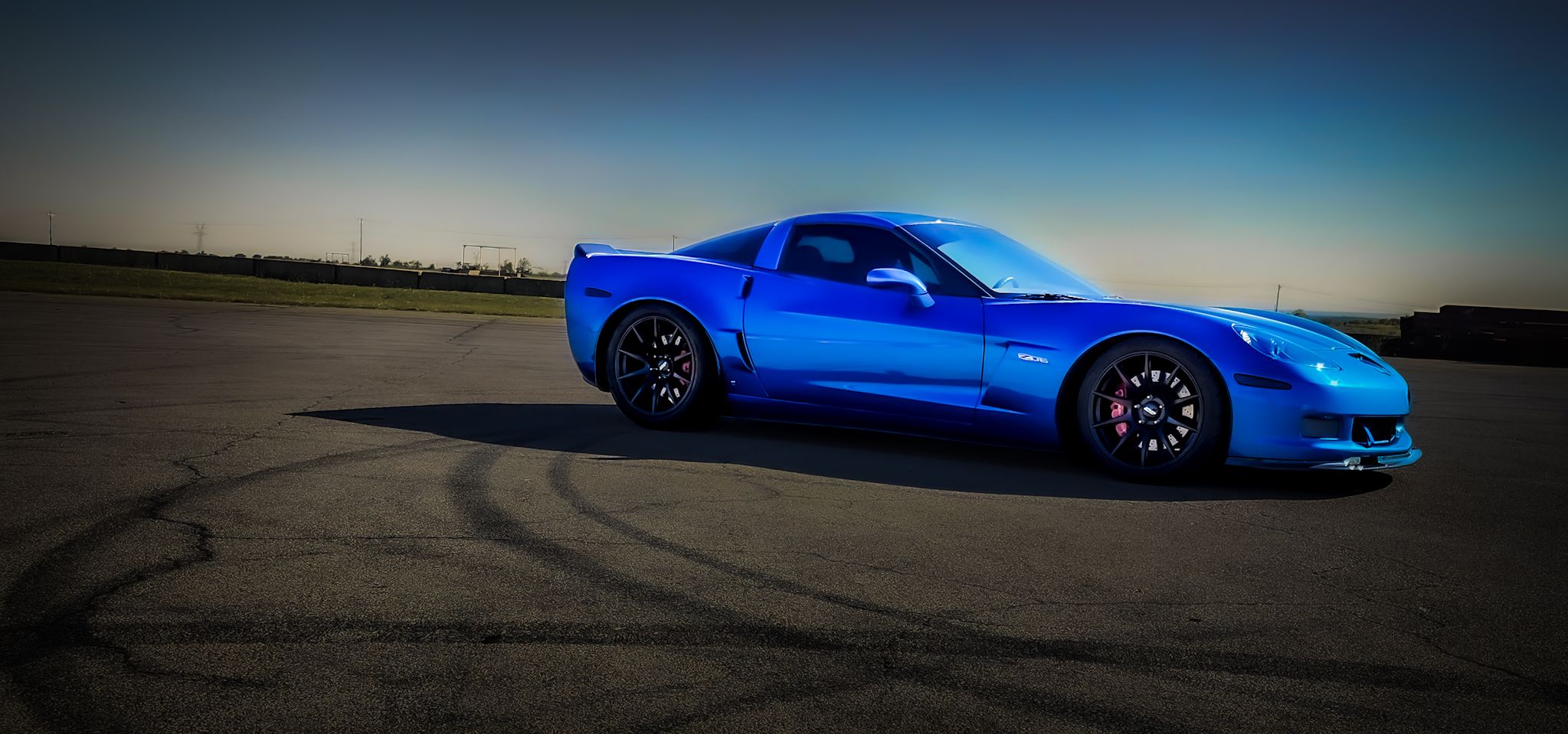 Blue Chevrolet C6 Corvette Z06 with 19" SM-10 Apex wheels in Satin Black