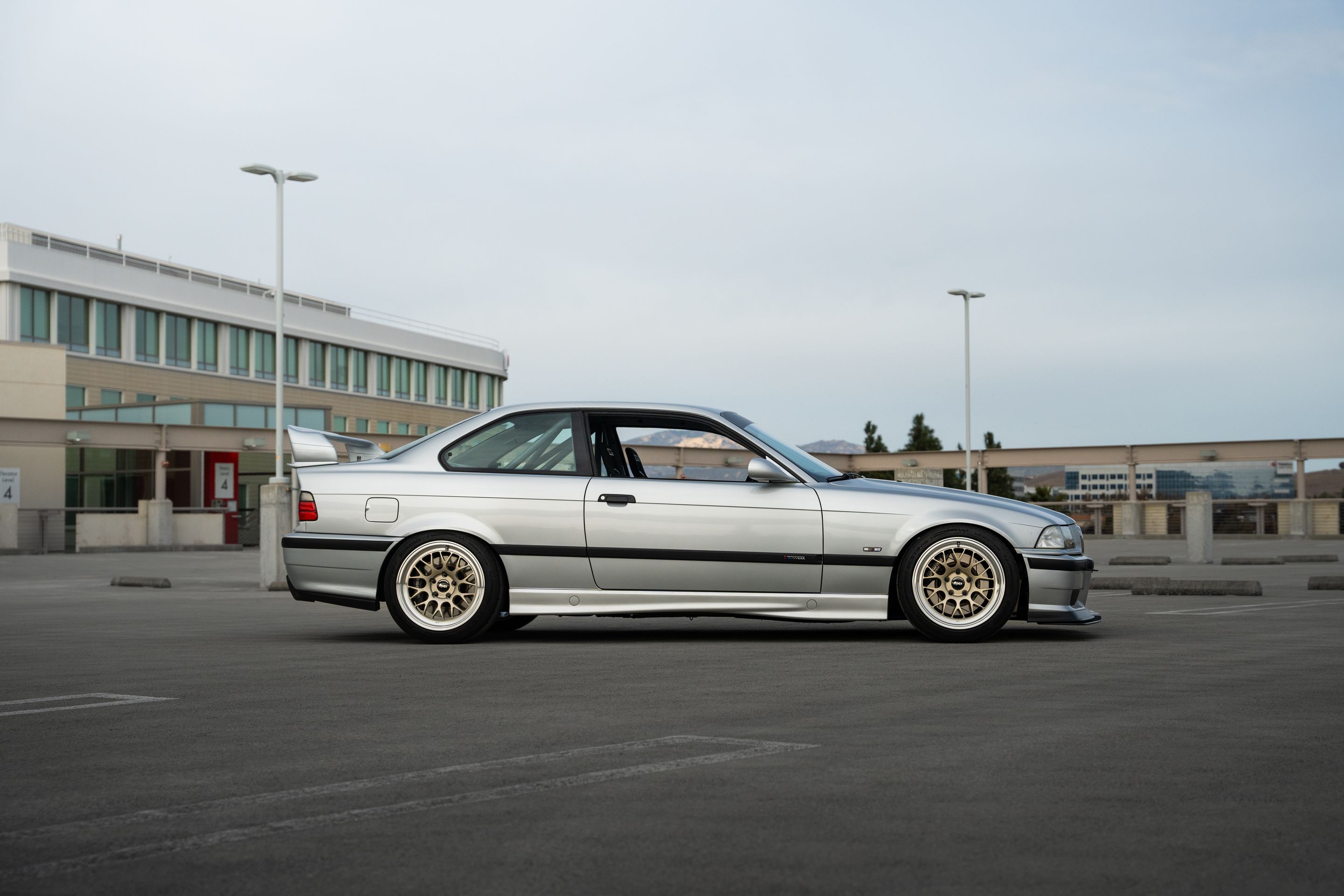 Silver BMW E36 3 Series with 17" ML-10RT Apex wheels in Machined Lip Gloss Motorsport Gold