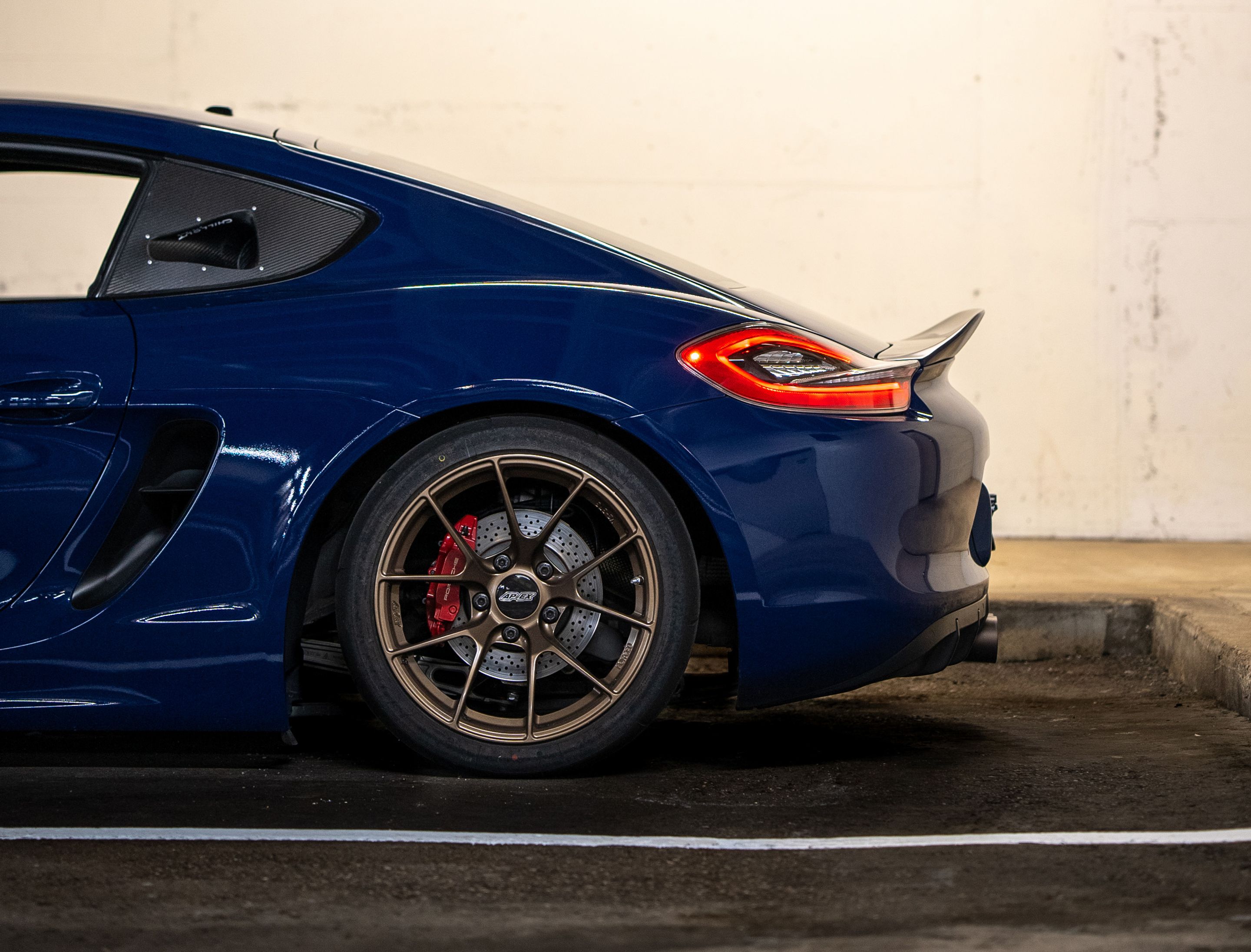 Blue Porsche 981 Cayman GTS with 18" VS-5RS Apex wheels in Satin Bronze
