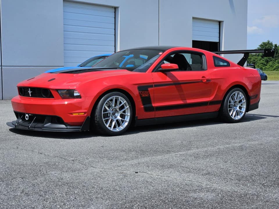 Red Ford S197 Mustang Boss 302 with 18" EC-7RS Apex wheels in Brushed Clear