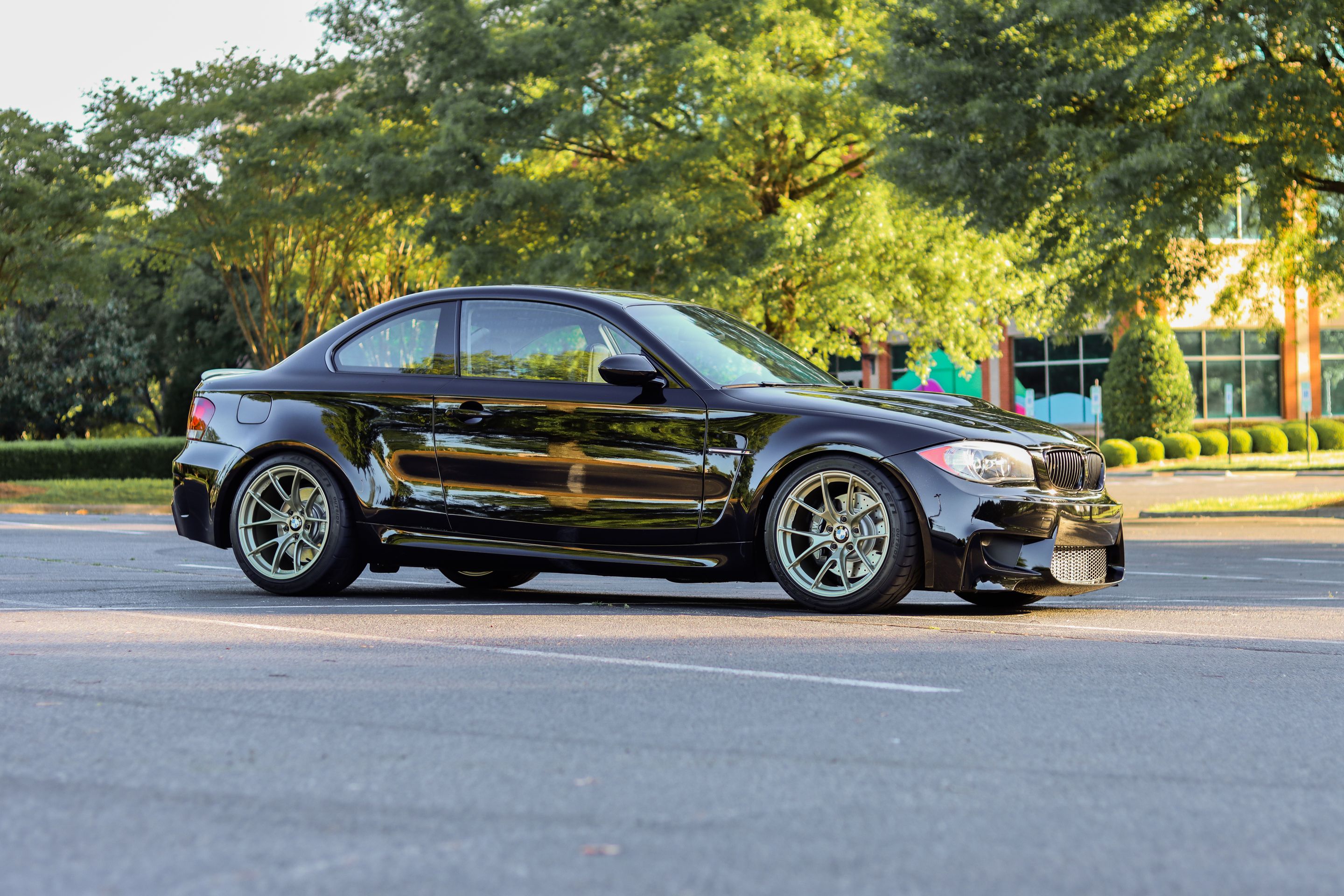 Black BMW E82 Coupe 1 Series with 18" VS-5RS Apex wheels in Motorsport Gold