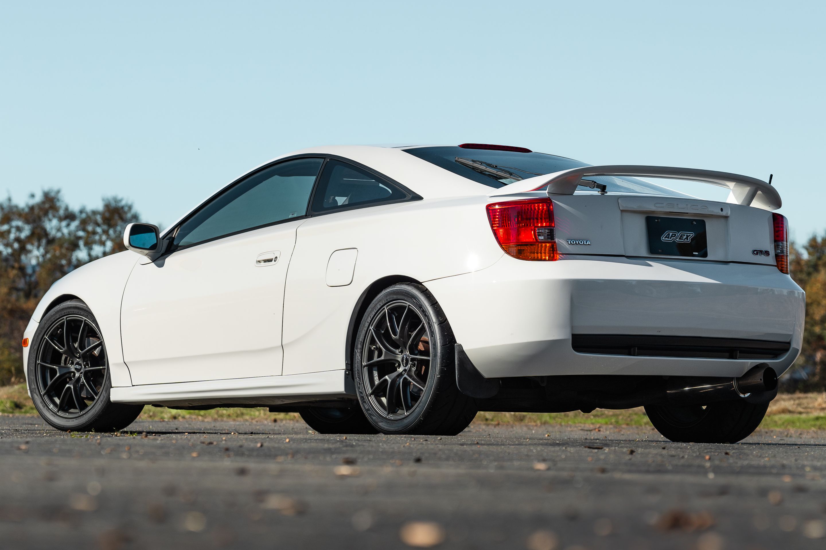 White Toyota 7th Gen Celica with 17" VS-5RS Apex wheels in Anthracite
