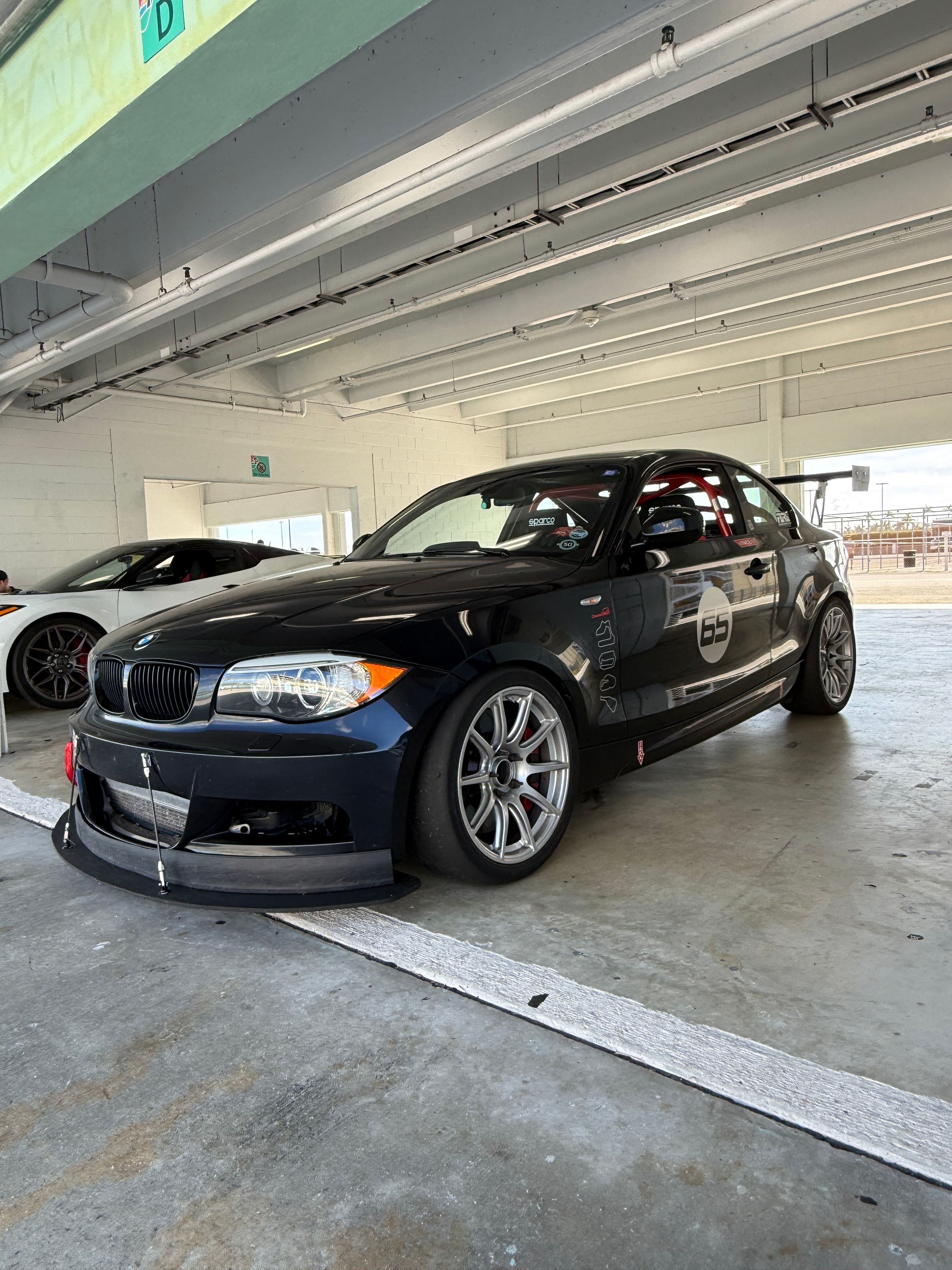 Black BMW E82 Coupe 1 Series with 18" SM-10 Apex wheels in Race Silver