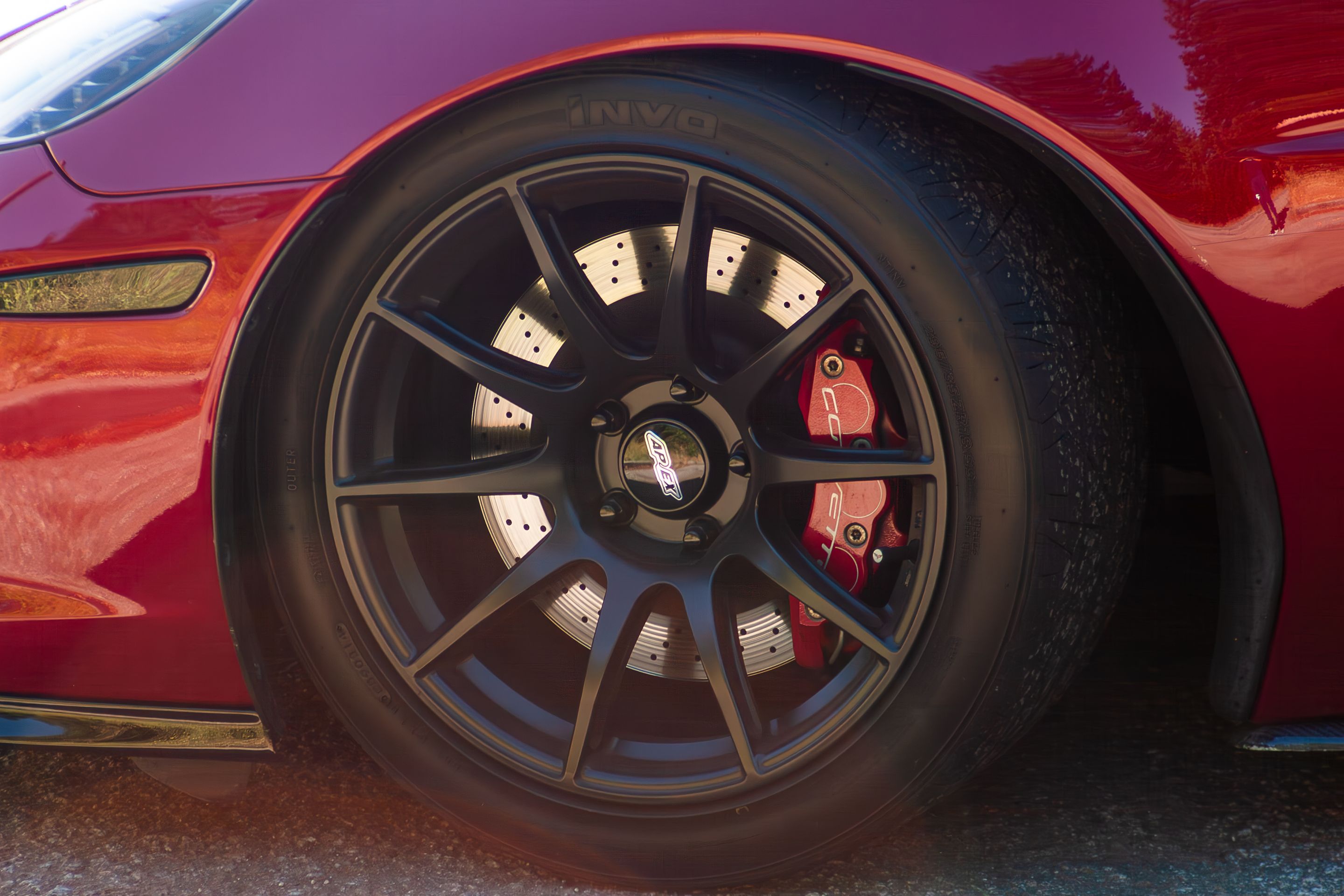 Red Chevrolet C6 Corvette Z06 with 18"/19" SM-10 Apex wheels in Satin Black