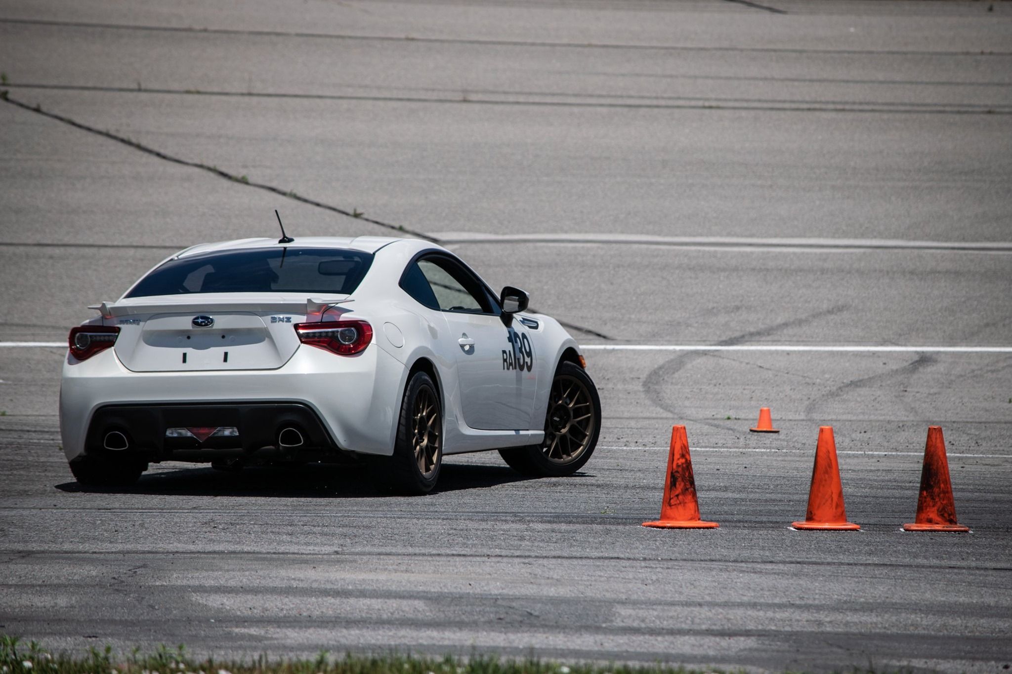White Subaru ZC6 / Gen 1 BRZ with 17" ARC-8 Apex wheels in Satin Bronze