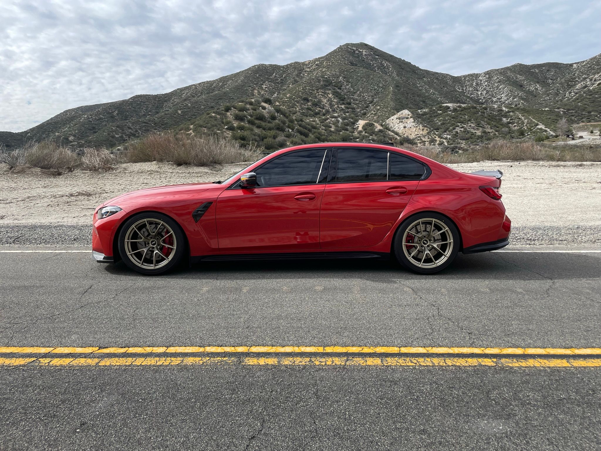 Red BMW G80 M3 with 19" VS-5RS Apex wheels in Motorsport Gold