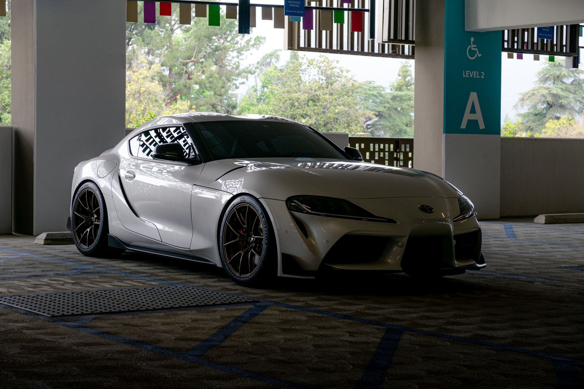 White Toyota GR Supra with 19" VS-5RS Apex wheels in Satin Bronze