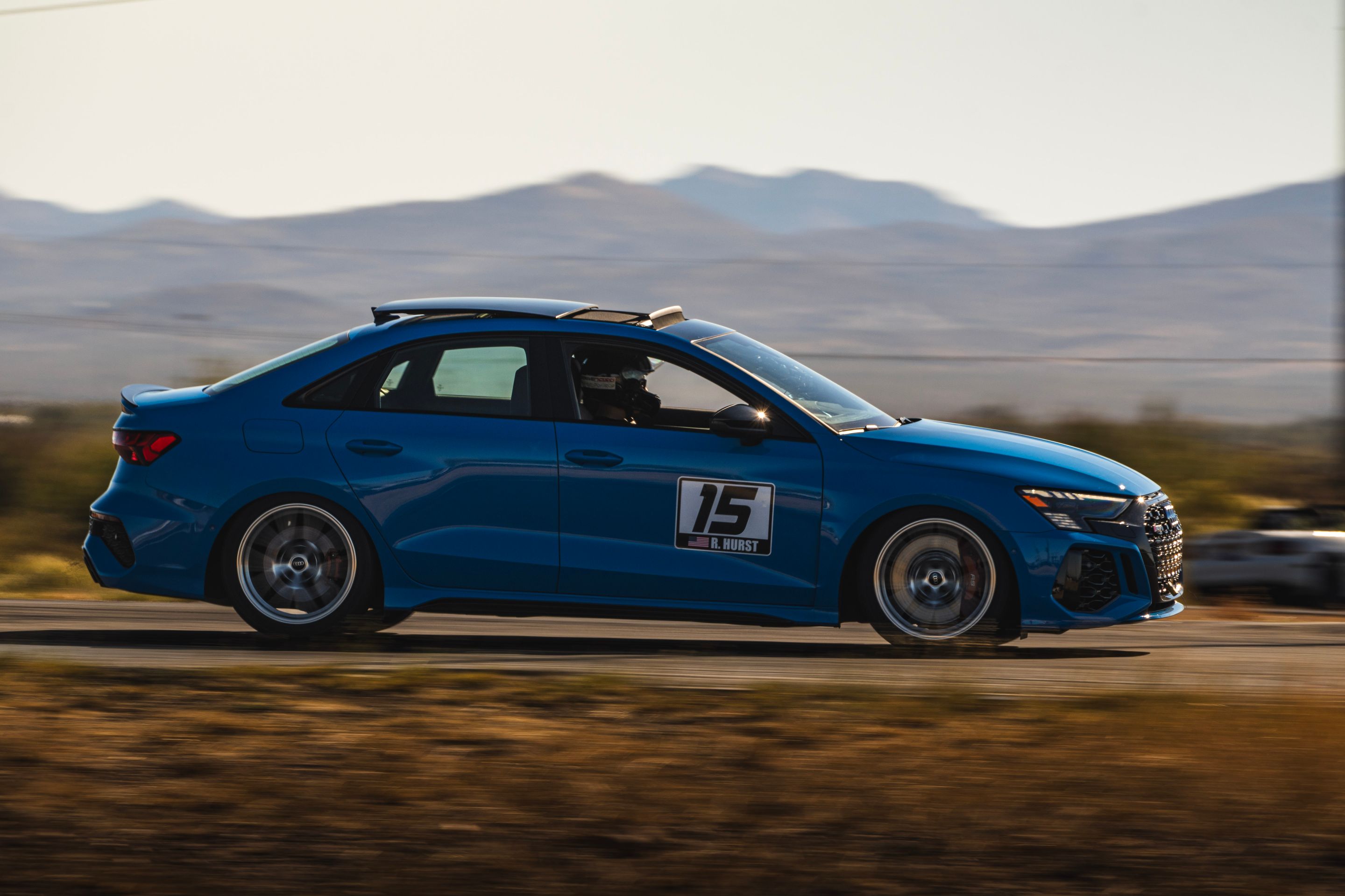 Blue Audi 8Y RS 3 with 18" VS-5RS Apex wheels in Brushed Clear