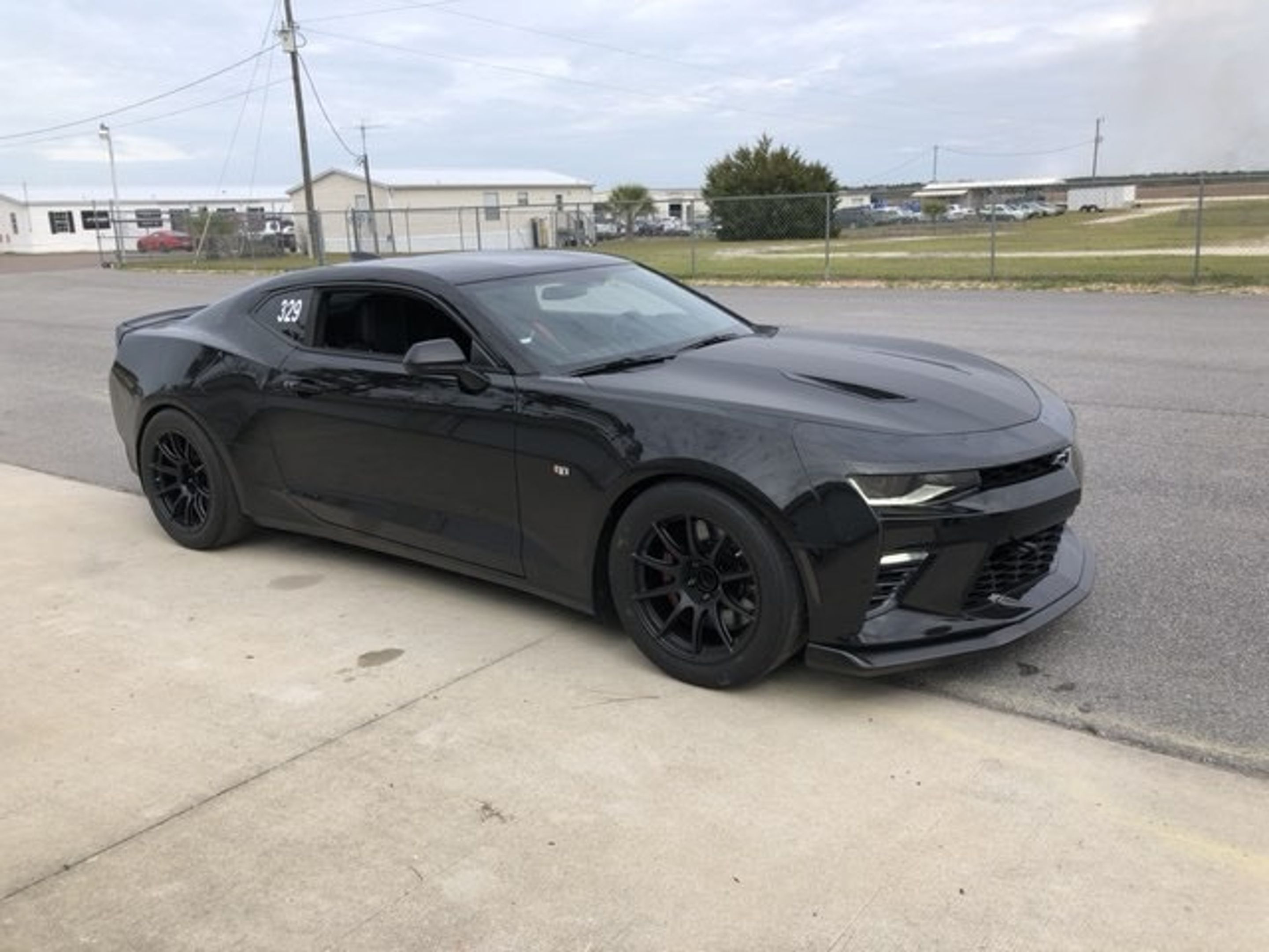 Black Chevrolet 6th Gen Camaro SS 1LE with 18" SM-10 Apex wheels in Satin Black