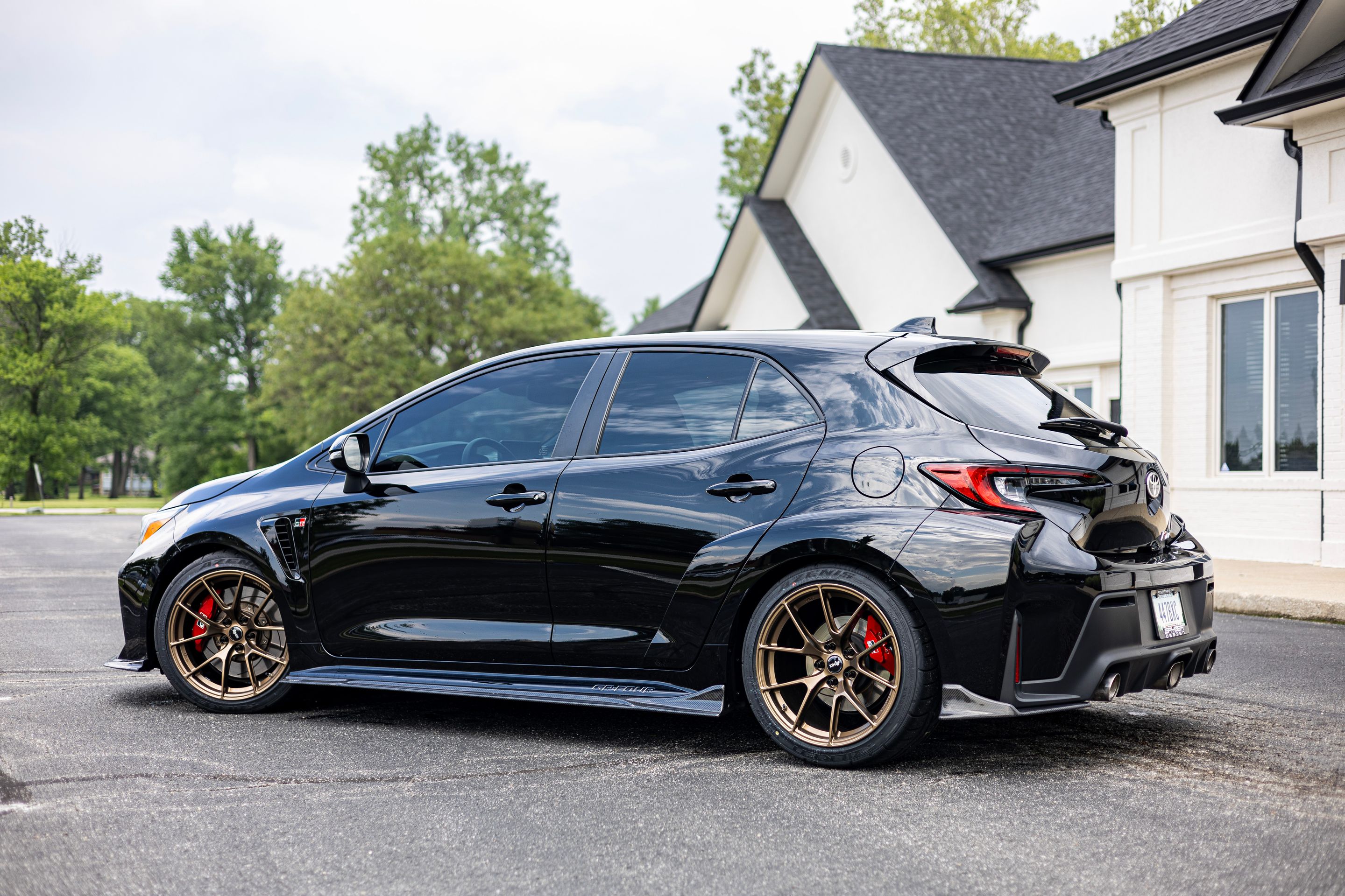 Black Toyota GR Corolla with 18" VS-5RS Apex wheels in Satin Bronze
