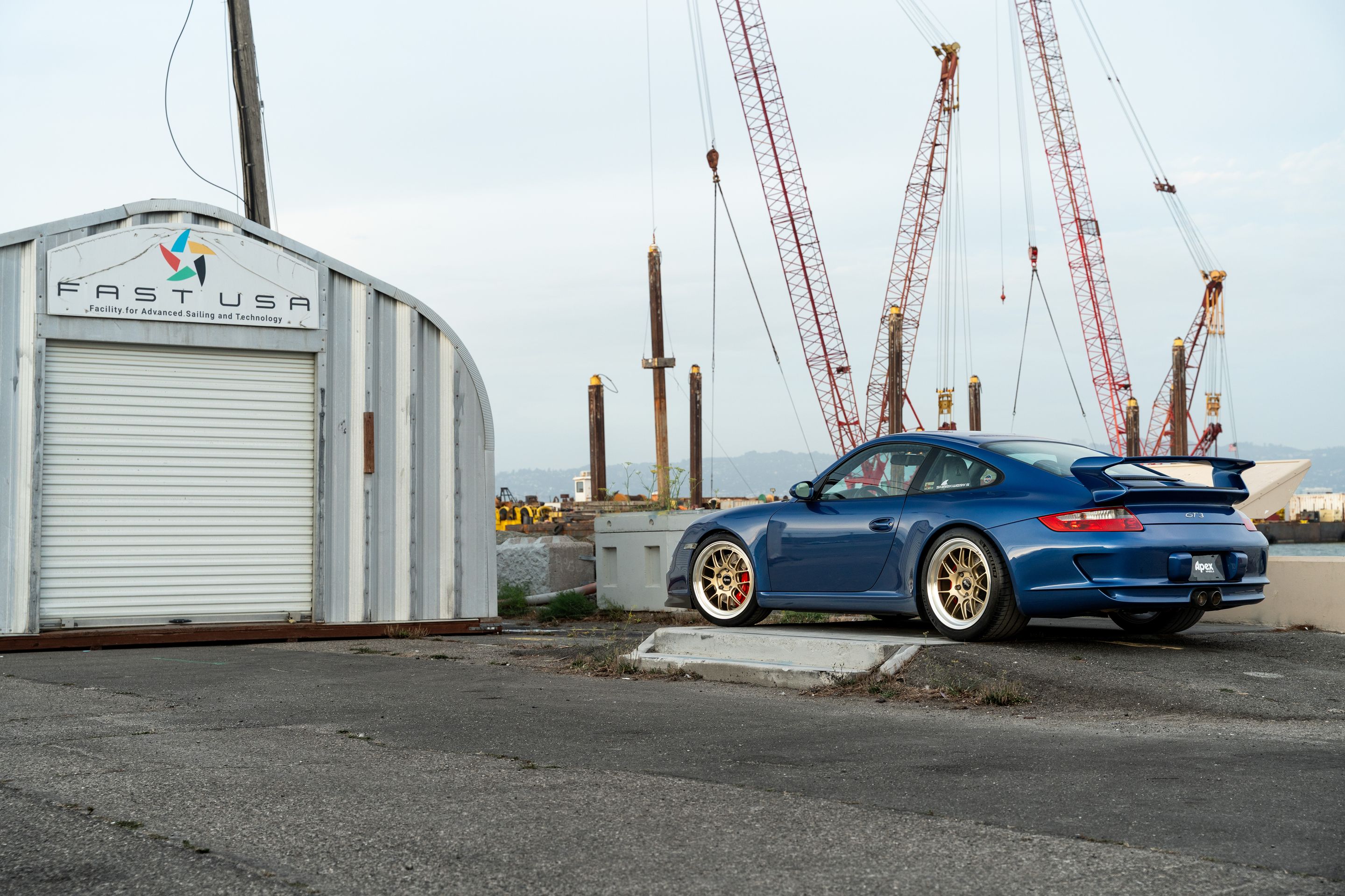 Blue Porsche 911 997 GT3 with 19" TEST-M Apex wheels in Machined Lip Gloss Motorsport Gold