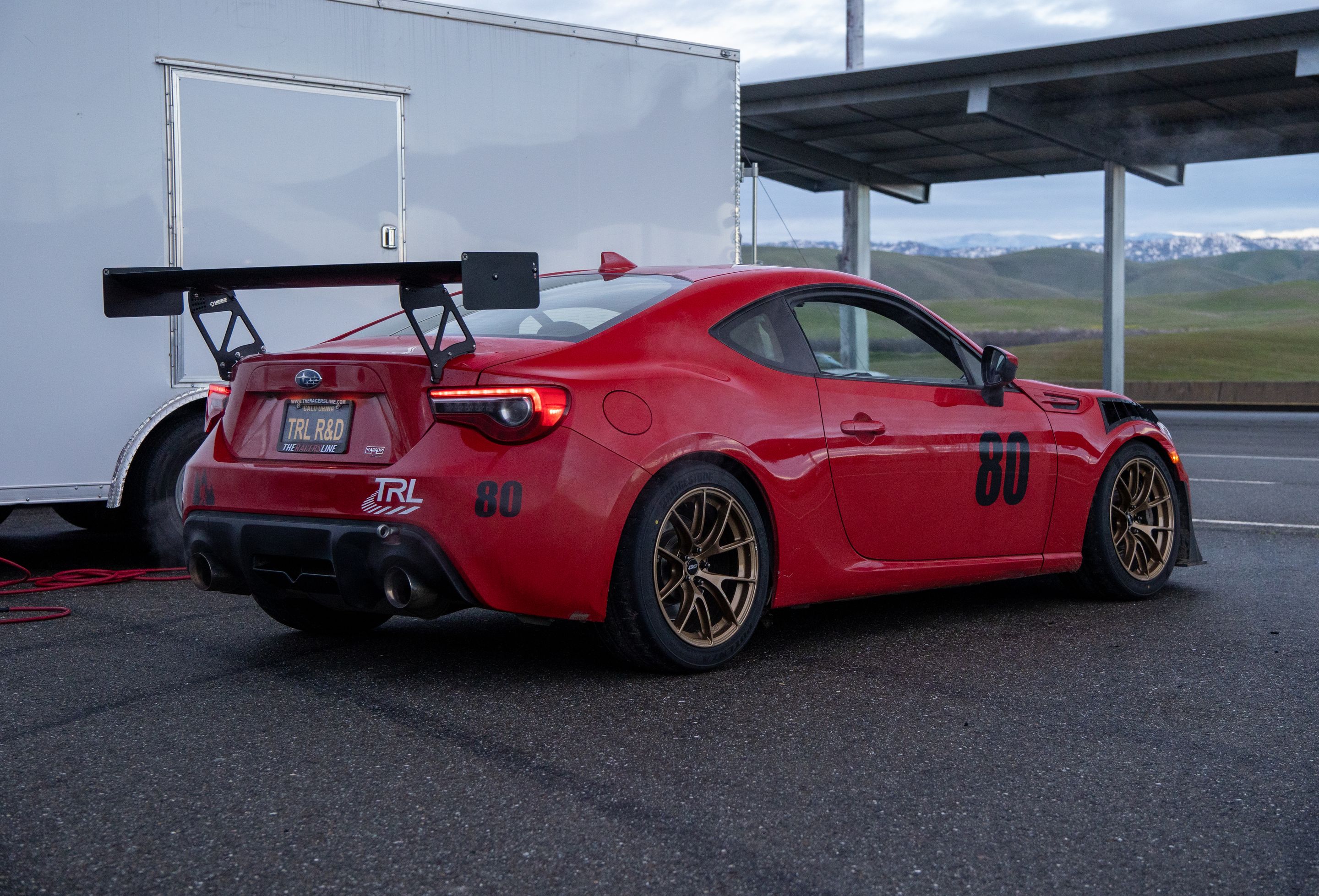Red Subaru ZC6 / Gen 1 BRZ with 17" VS-5RS Apex wheels in Gloss Gold