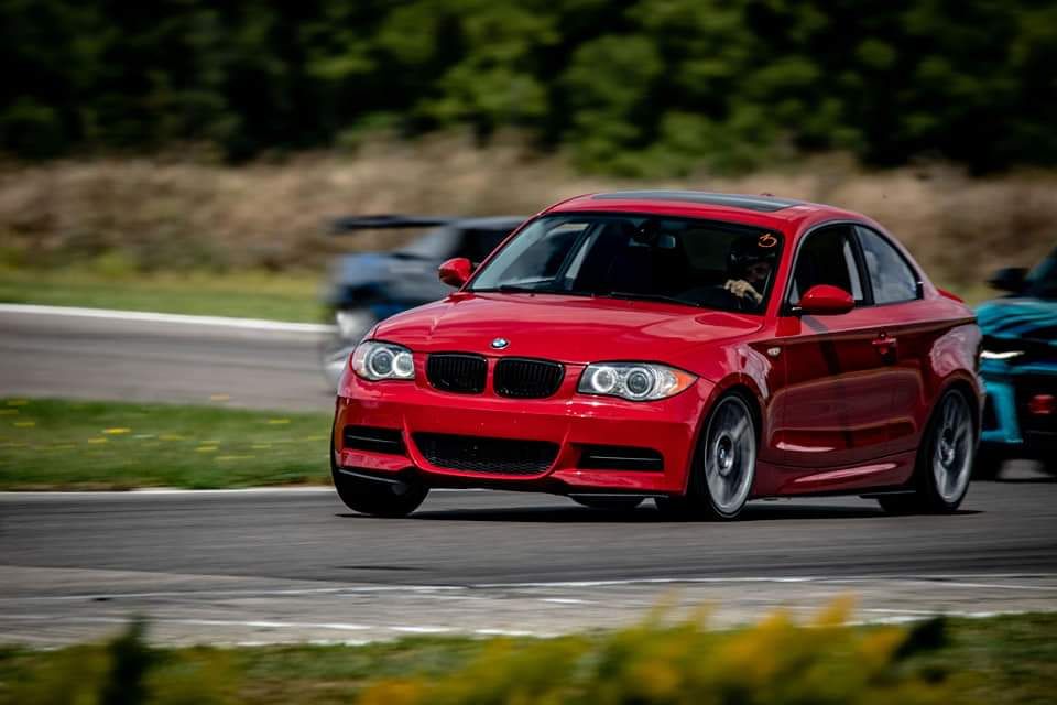 Red BMW E82 Coupe 1 Series with 18" ARC-8 Apex wheels in Hyper Black