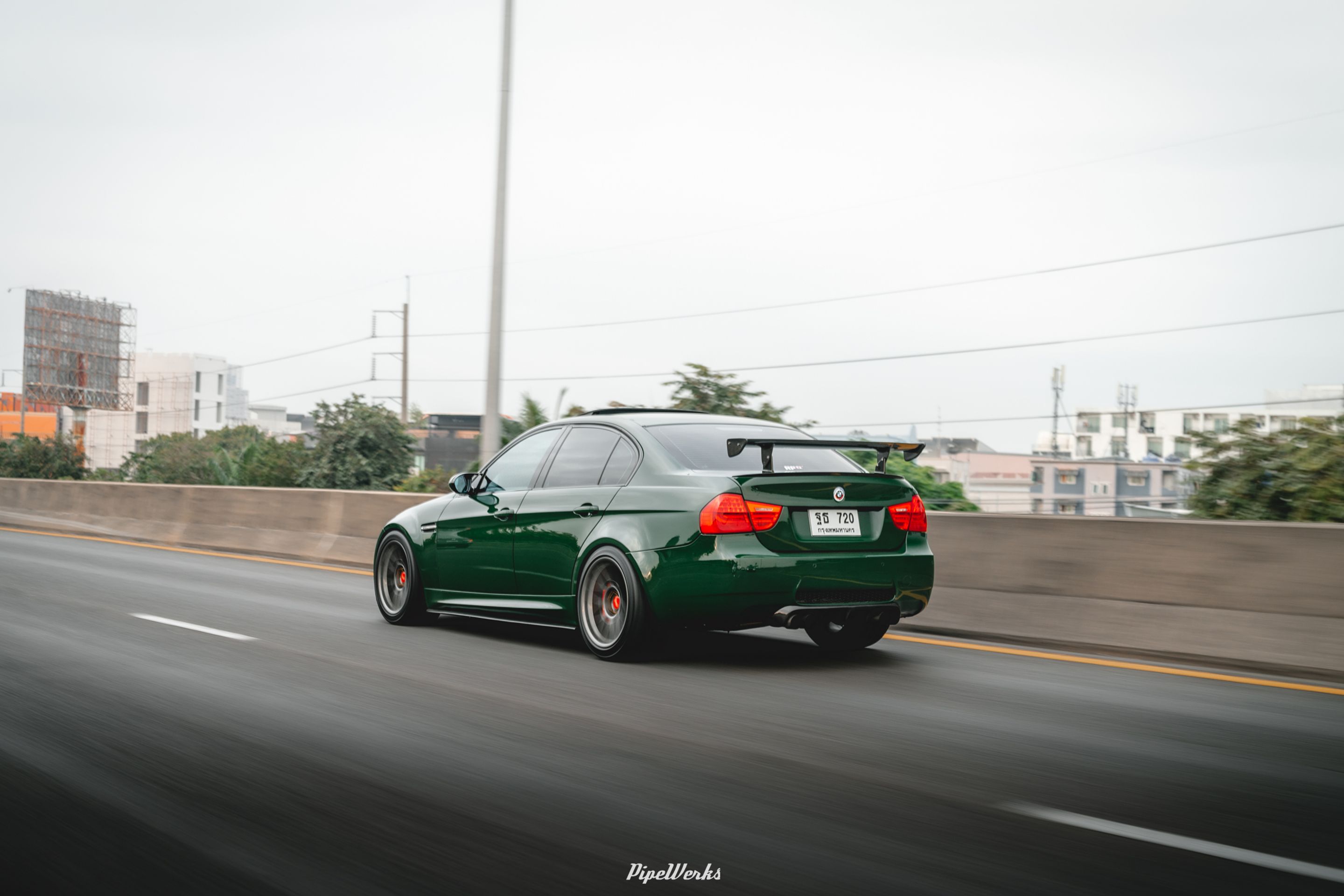 Green BMW E90 Sedan 3 Series with 18" ARC-8 Apex wheels in Anthracite