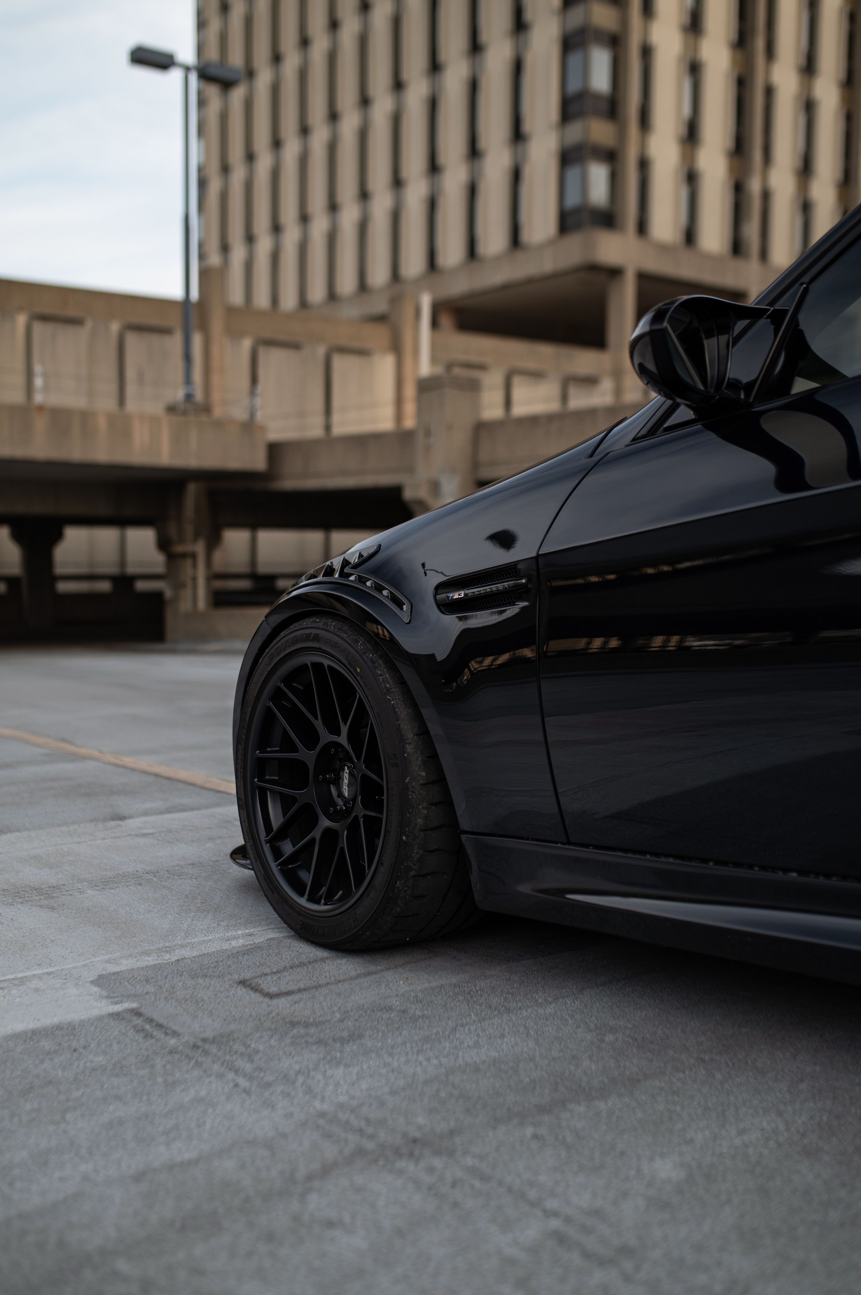 Black BMW E90 Sedan M3 with 18" ARC-8 Apex wheels in Satin Black