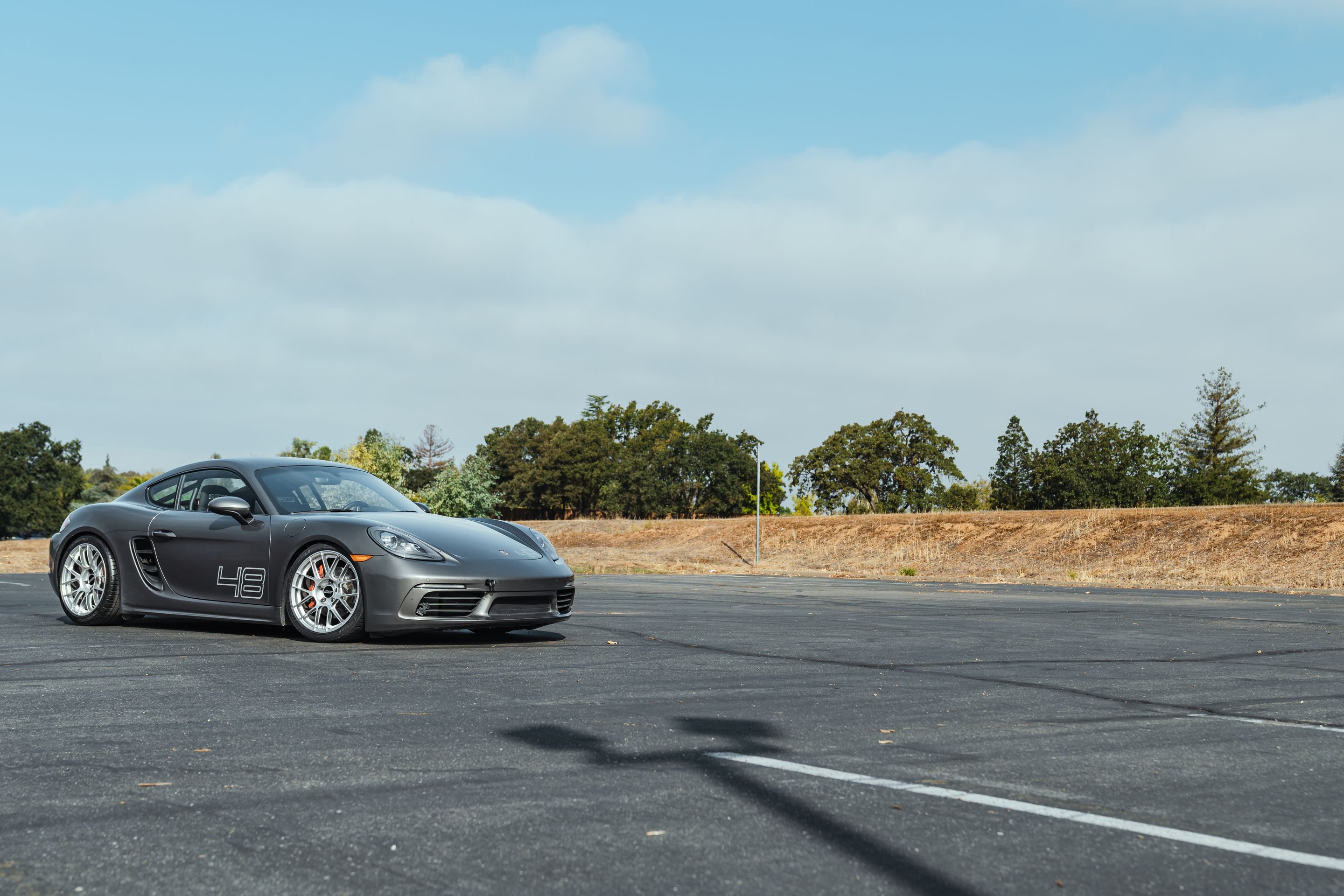 Grey Porsche 718 Cayman S with 19" EC-7RS Apex wheels in Race Silver