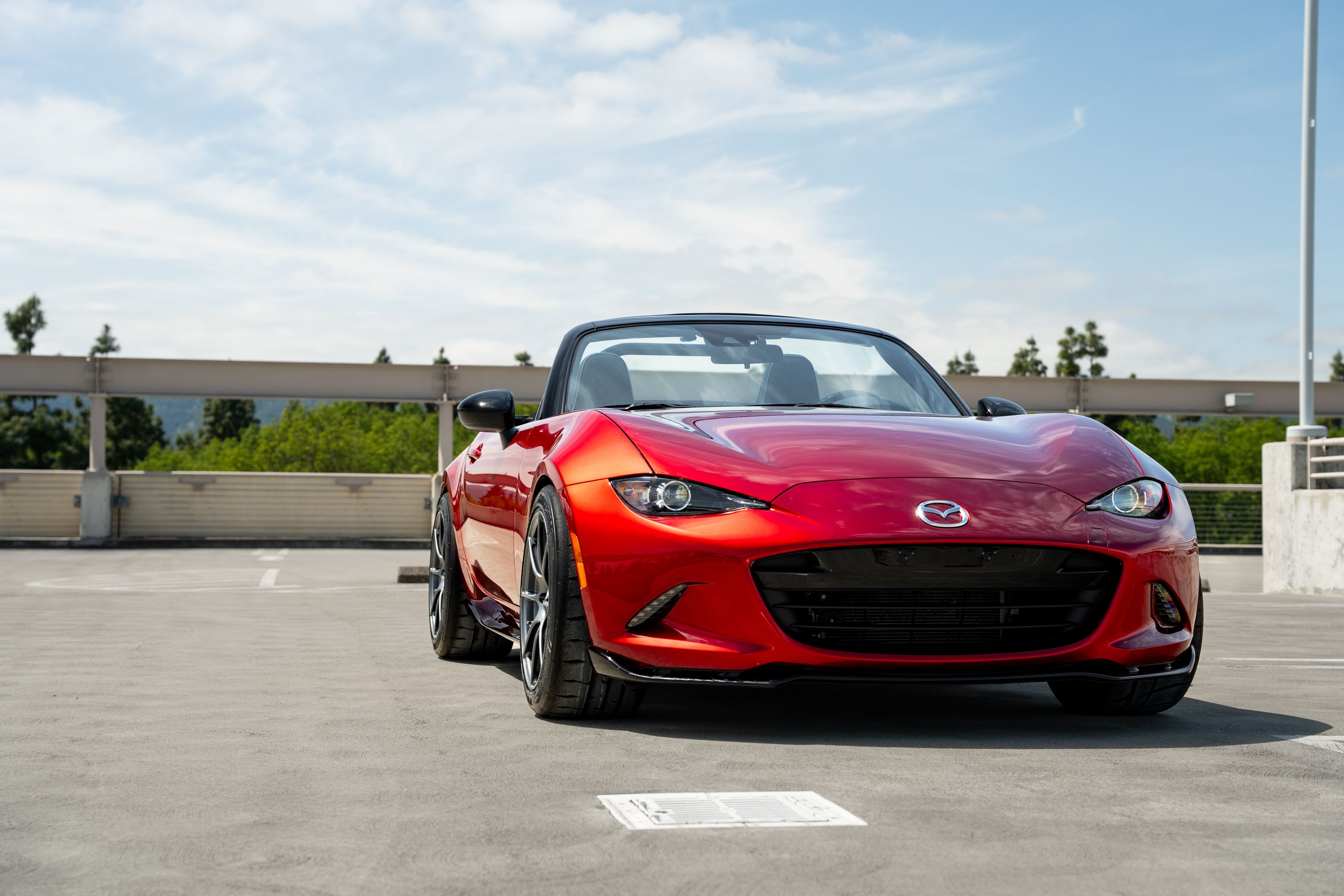 Red Mazda ND MX-5 Miata with 17" SM-8RS Apex wheels in Anthracite