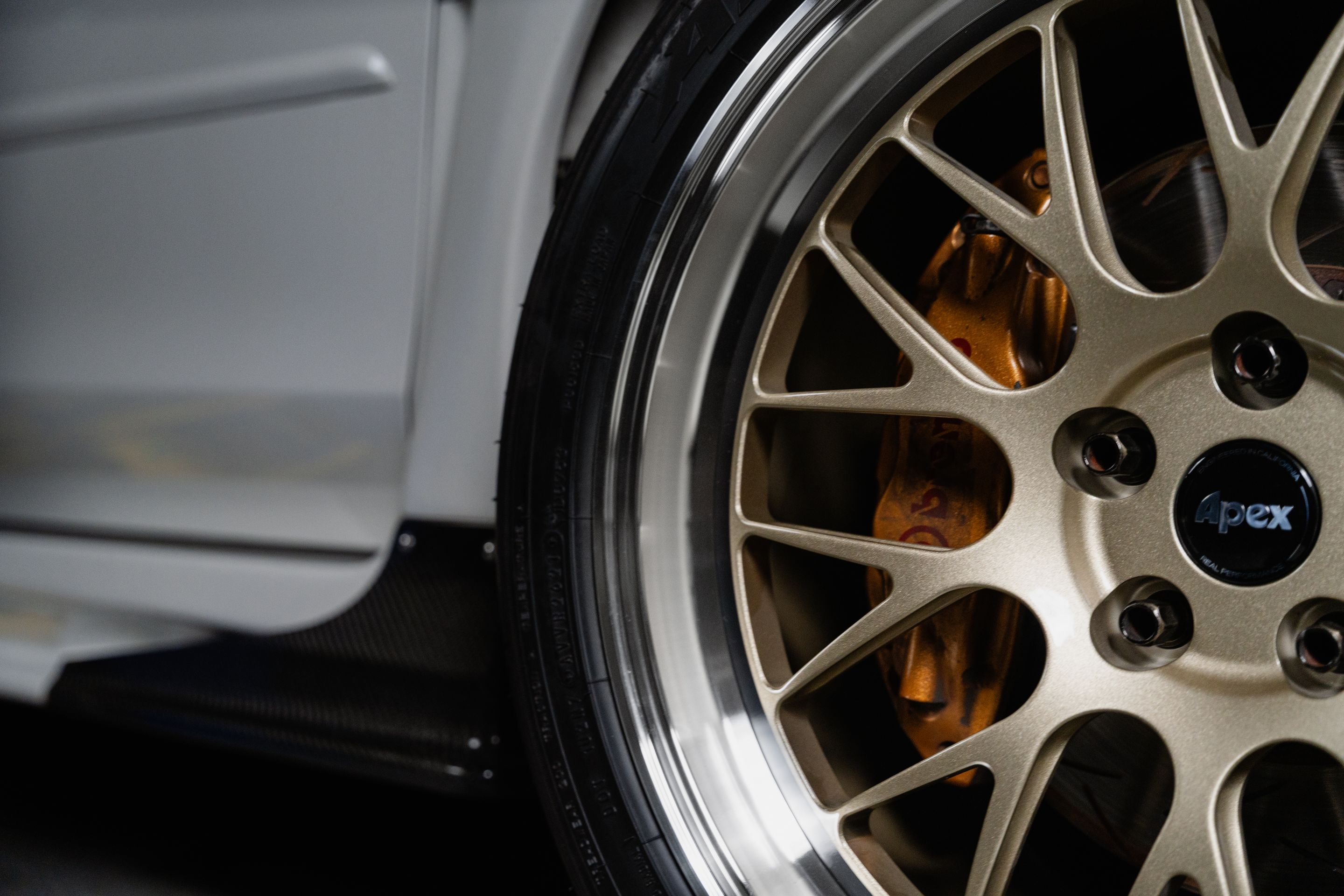 White Subaru VA WRX STI with 18" ML-10RT Apex wheels in Machined Lip Gloss Motorsport Gold