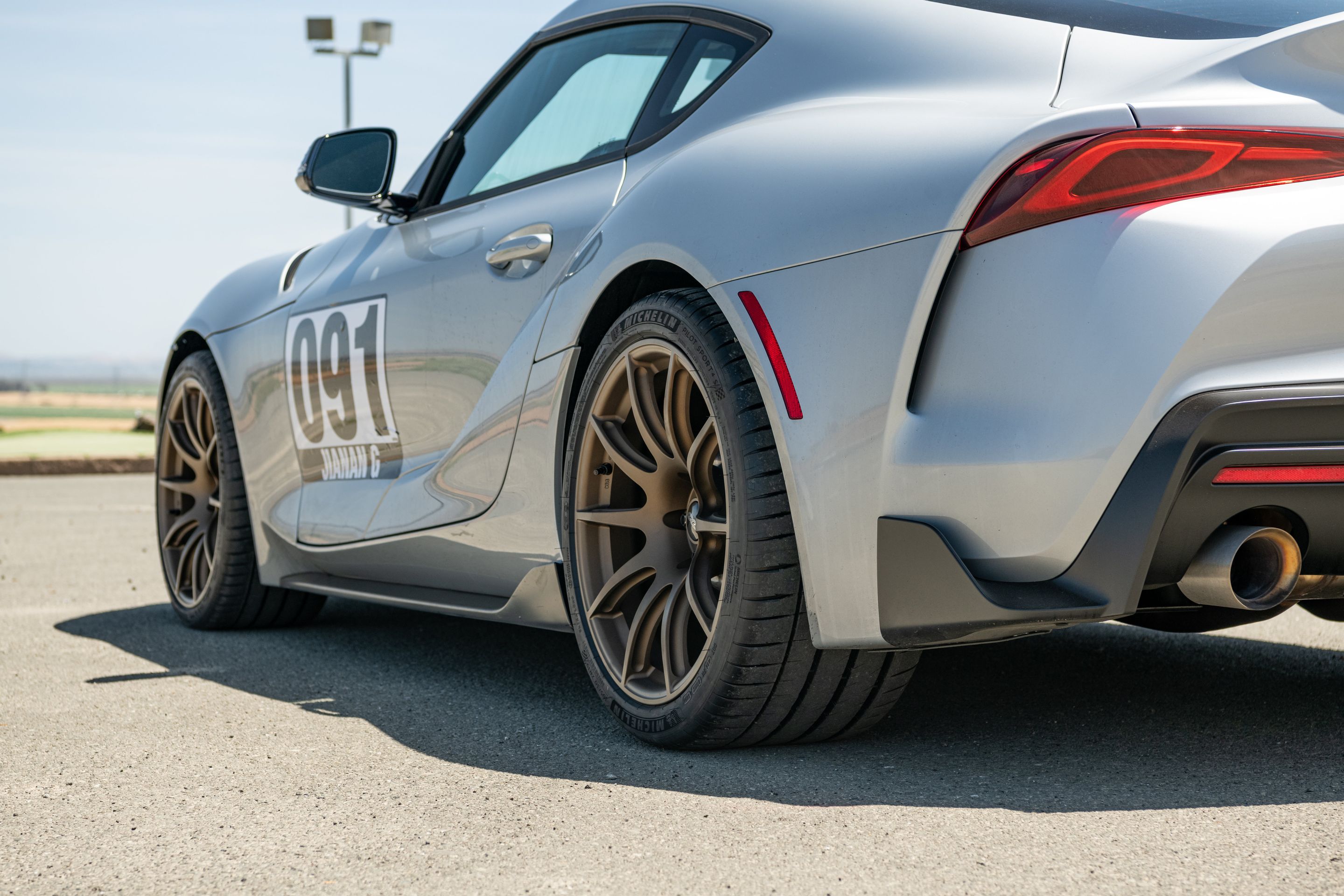 Silver Toyota GR Supra with 19" SM-10 Apex wheels in Satin Bronze