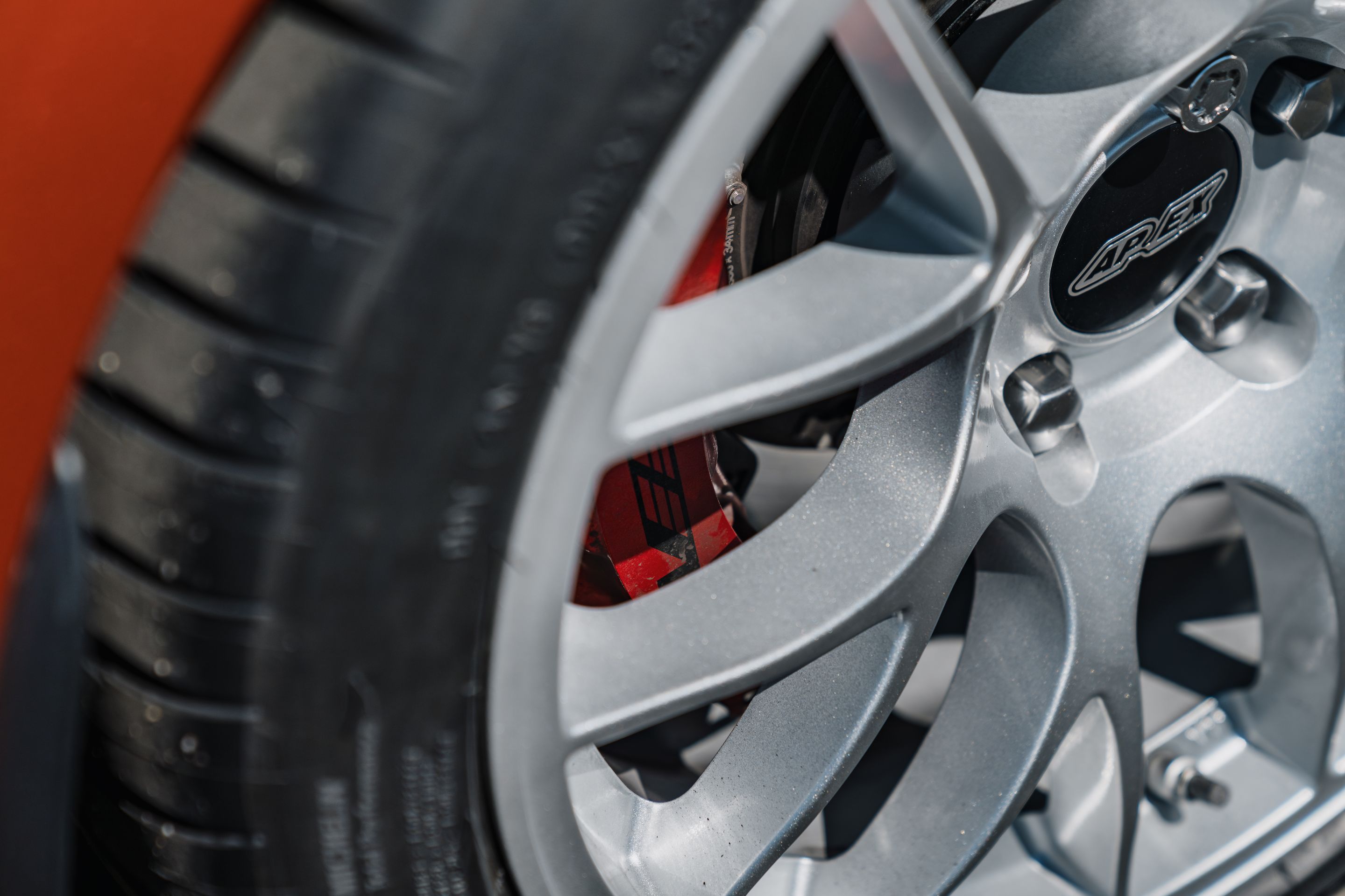 Orange Cadillac CT4-V Blackwing with 18" EC-7 Apex wheels in Race Silver