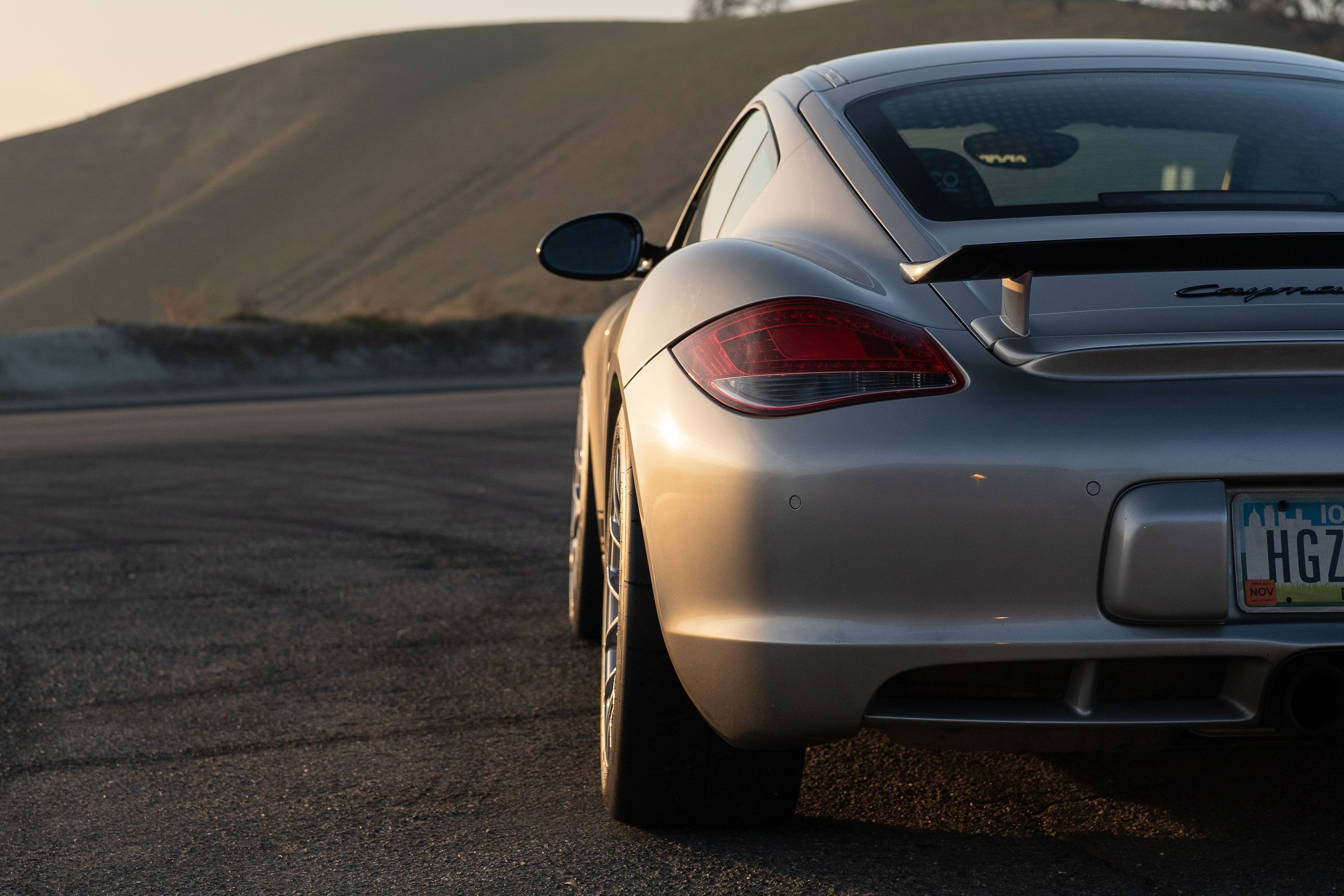 Grey Porsche 987 Cayman R with 18" EC-7RS Apex wheels in Race Silver