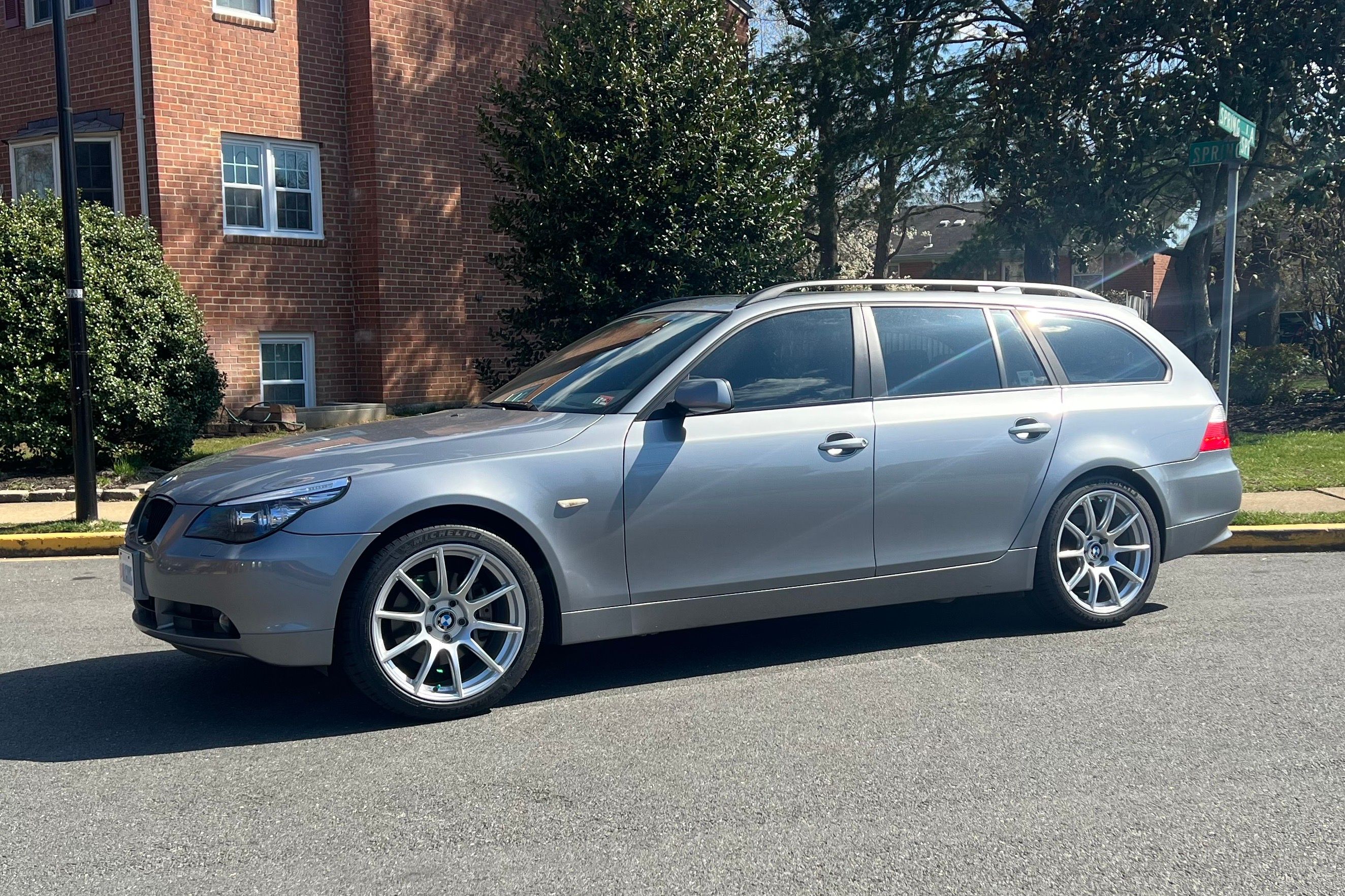 Grey BMW E61 Wagon 5 Series with 19" SM-10 Apex wheels in Race Silver