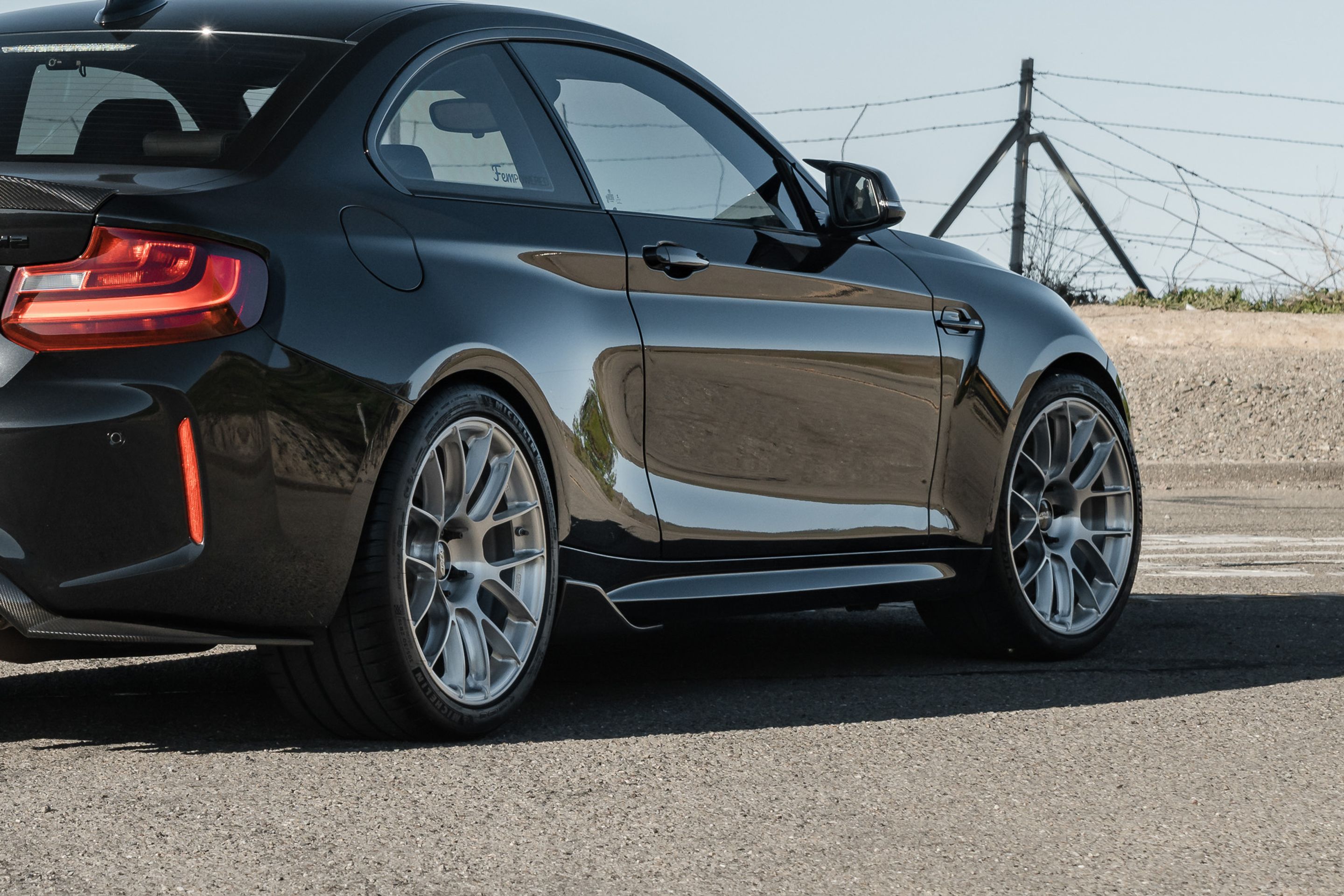 Black BMW F87 M2 with 19" EC-7RS Apex wheels in Brushed Clear