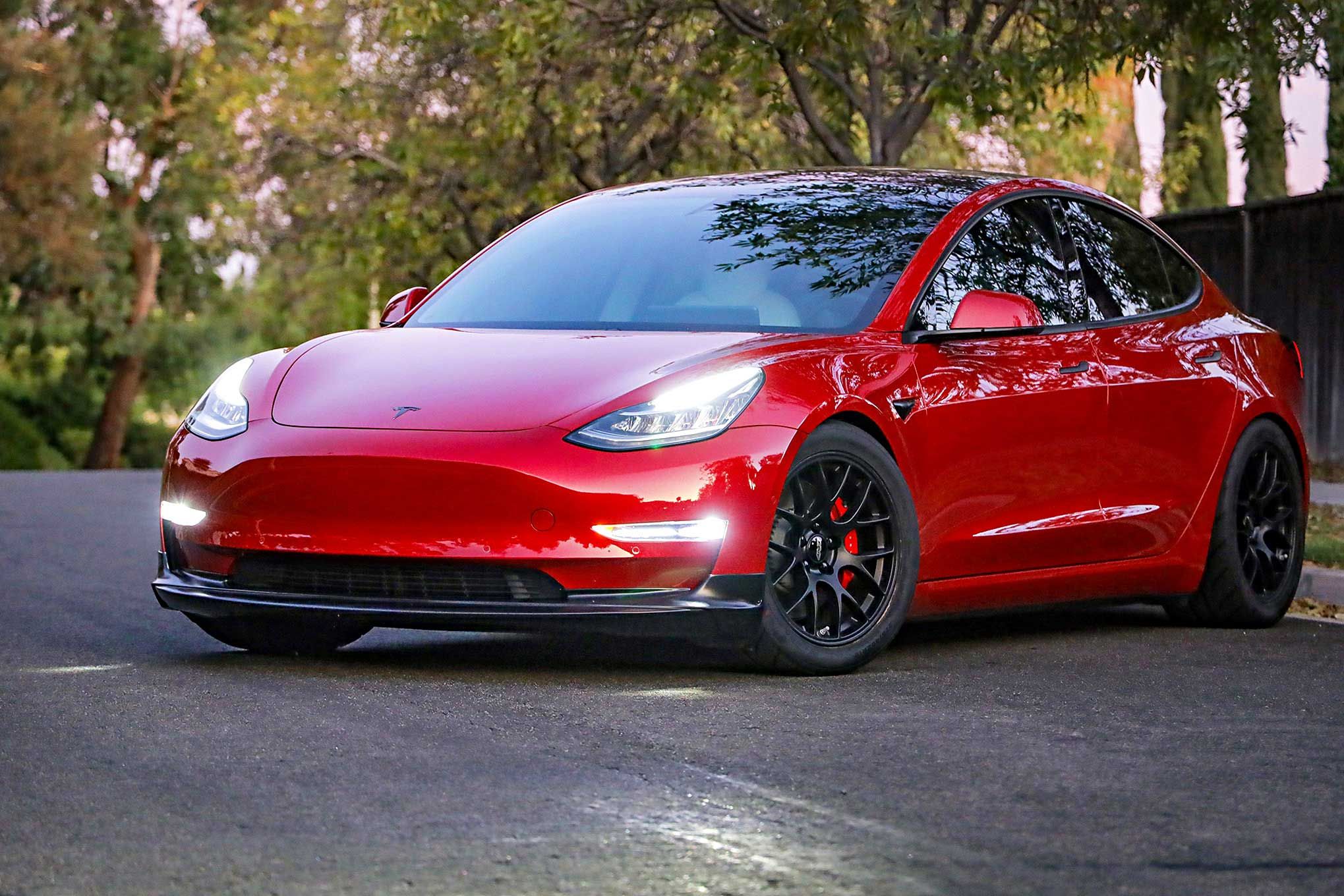 Red Tesla Model 3 with 18" EC-7 Apex wheels in Satin Black