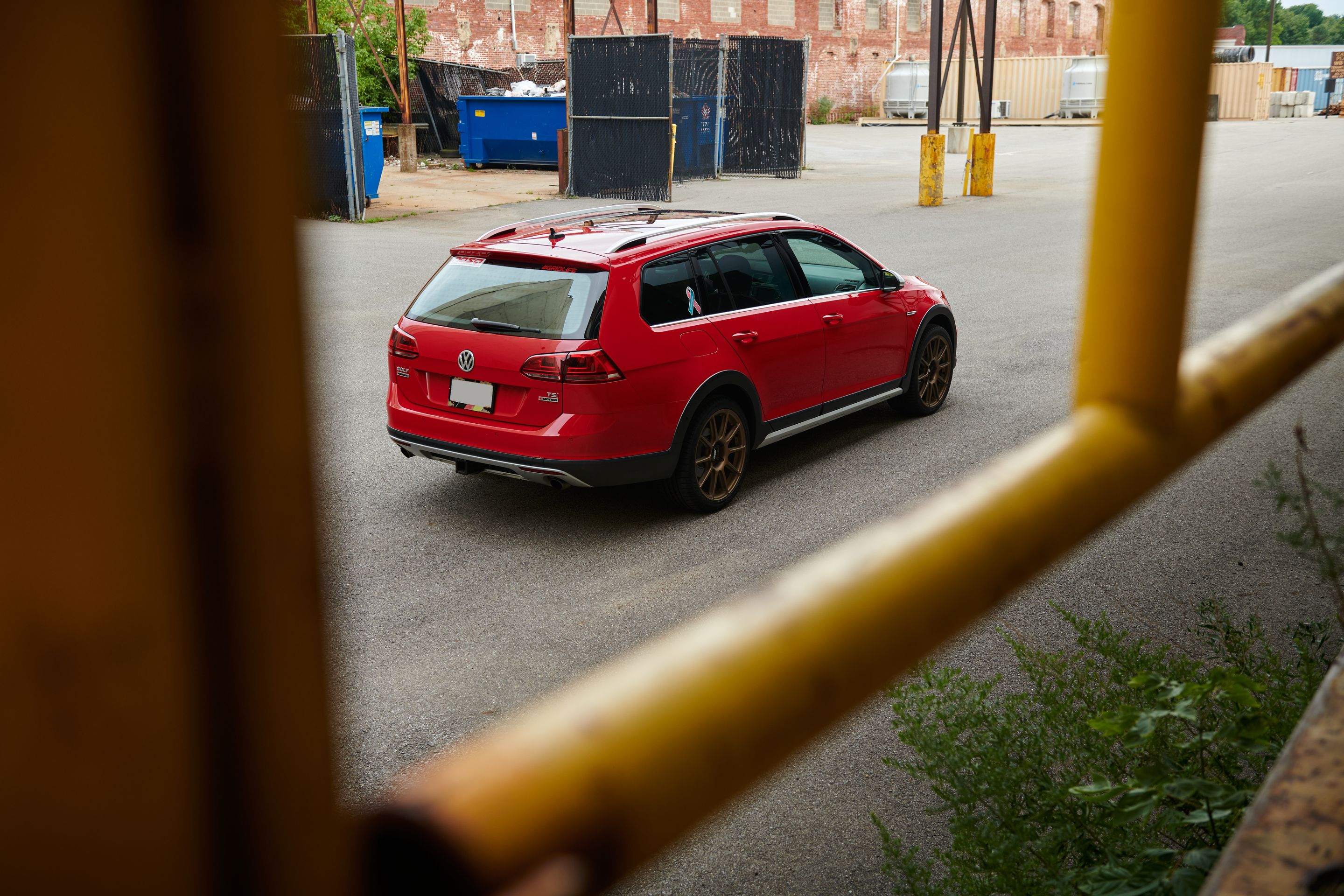 Red VW MK7 Alltrack/SportWagen Alltrack with 18" SM-10 Apex wheels in Satin Bronze