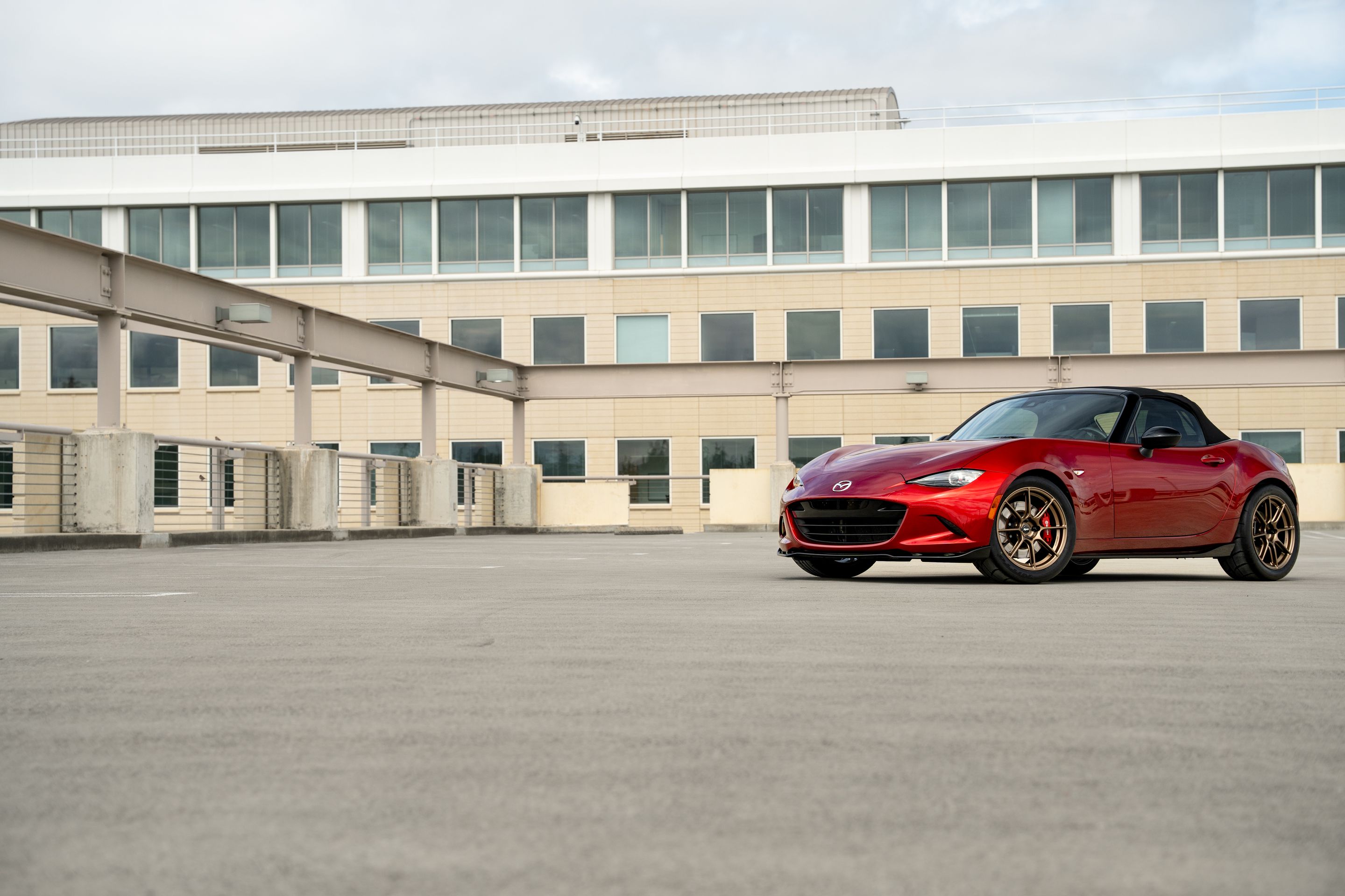 Red Mazda ND MX-5 Miata with 17" SM-8RS Apex wheels in Satin Bronze