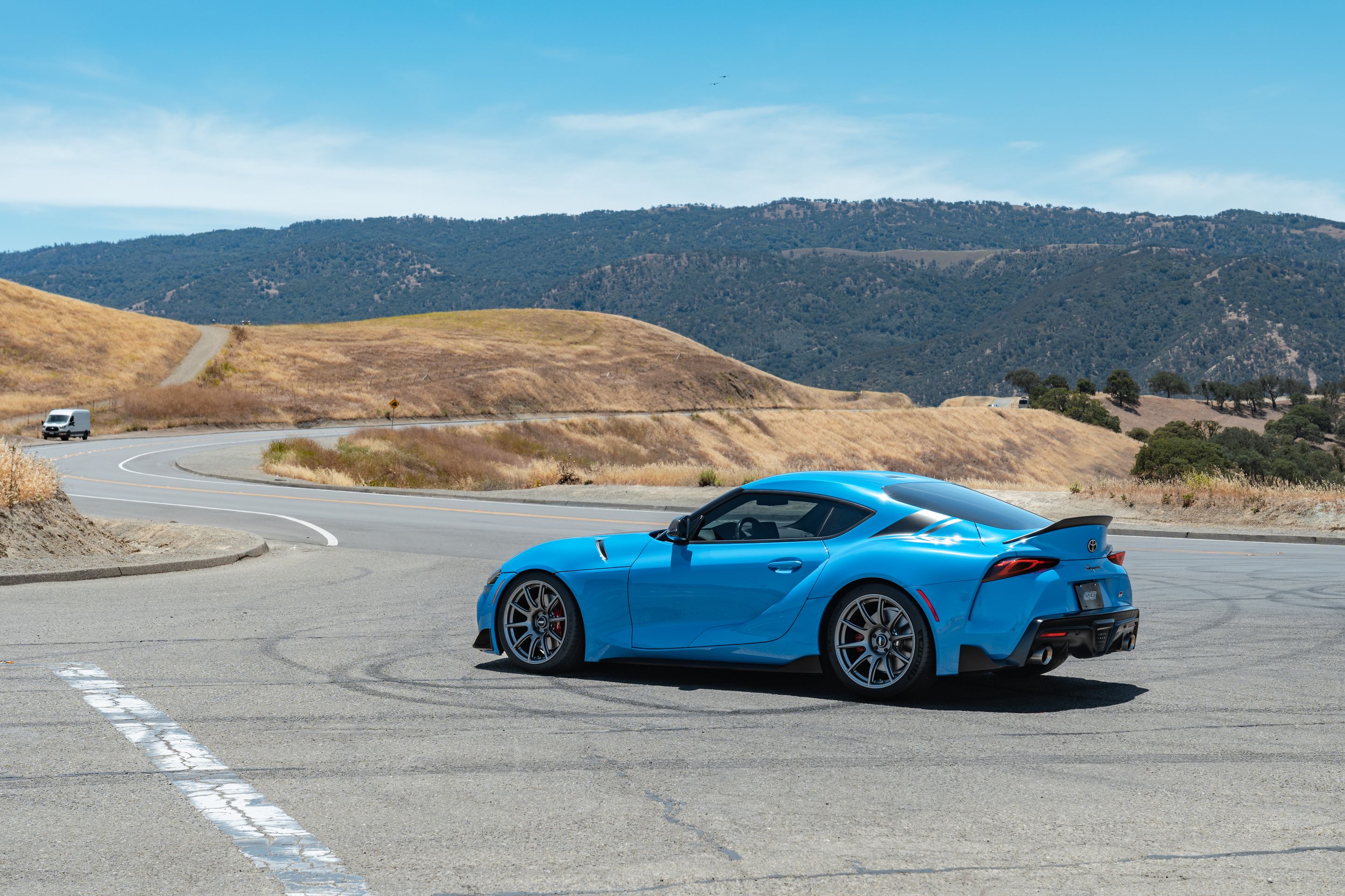 Blue Toyota GR Supra with 19" SM-10 Apex wheels in Anthracite
