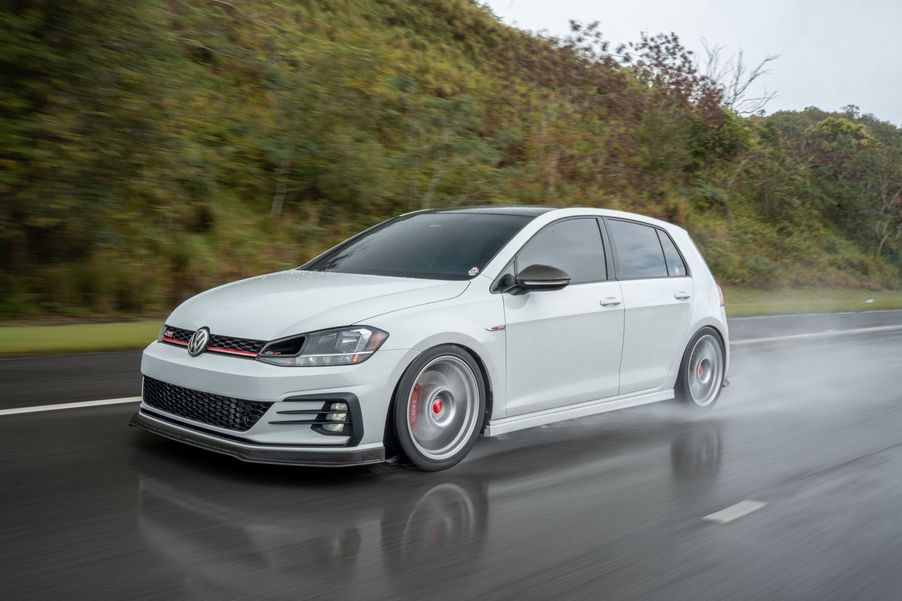 White VW MK7 GTI with 18" SM-10 Apex wheels in Race Silver