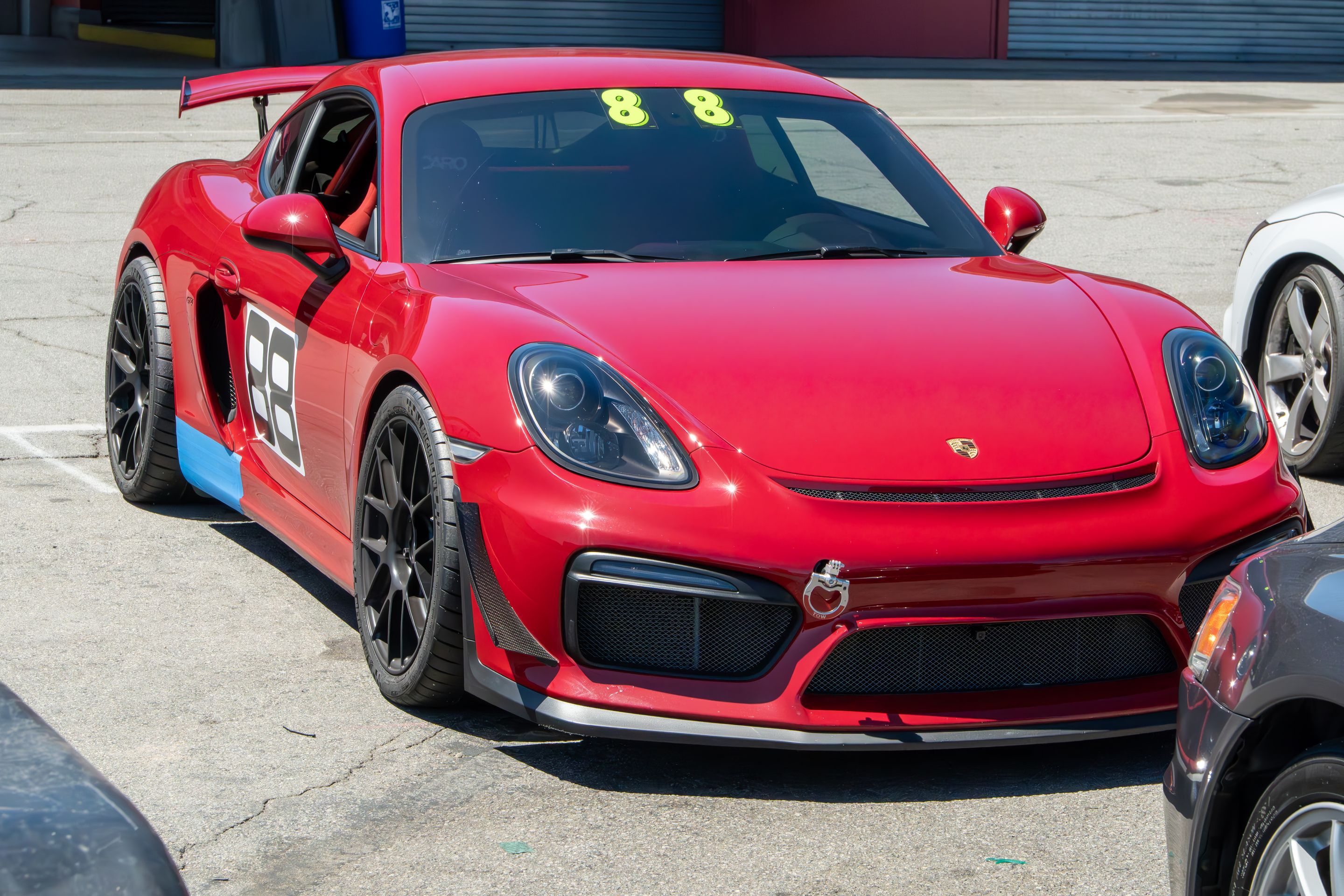 Red Porsche 981 Cayman GT4 with 19" EC-7RS Apex wheels in Satin Black