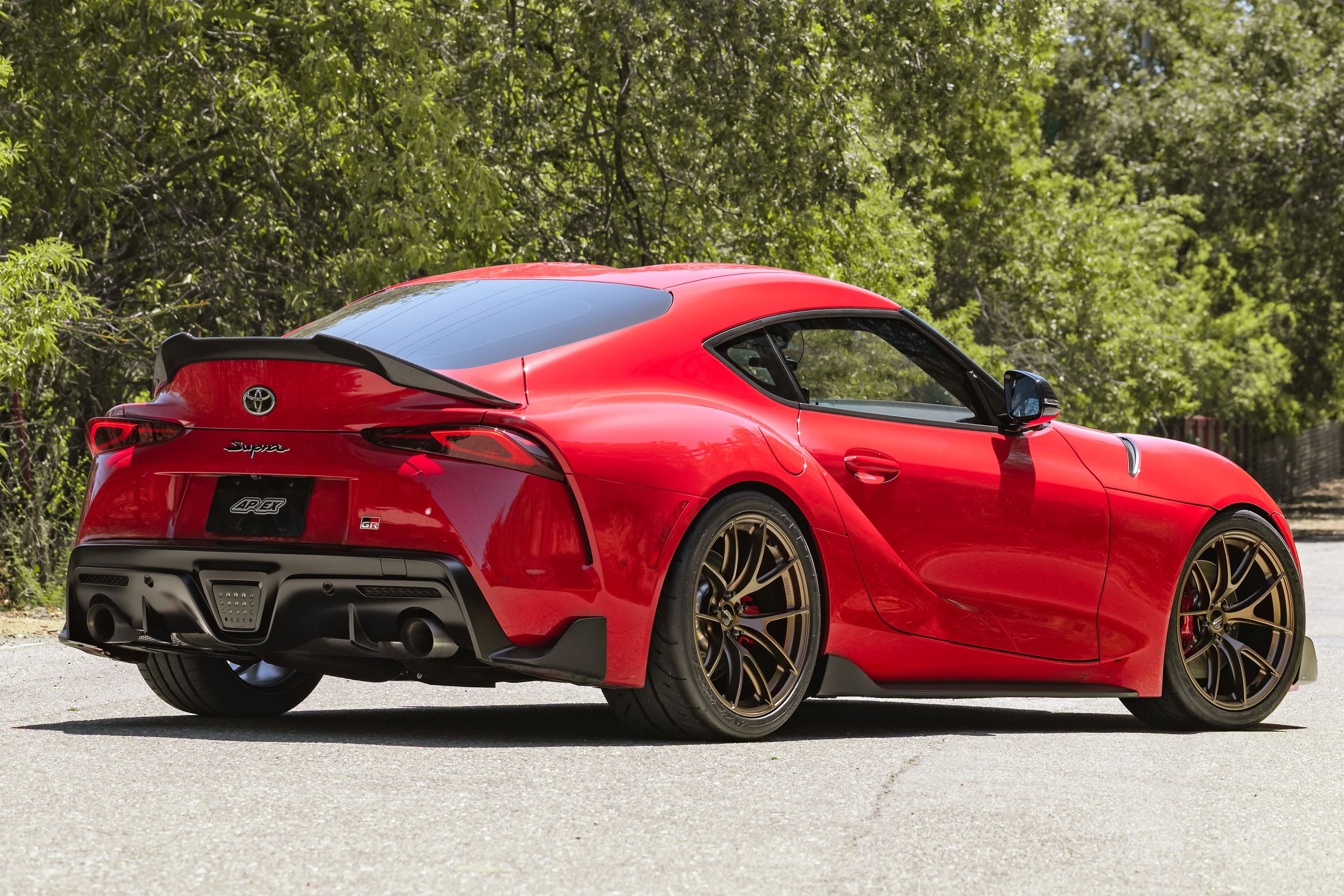 Red Toyota GR Supra with 19" VS-5RS Apex wheels in Satin Bronze