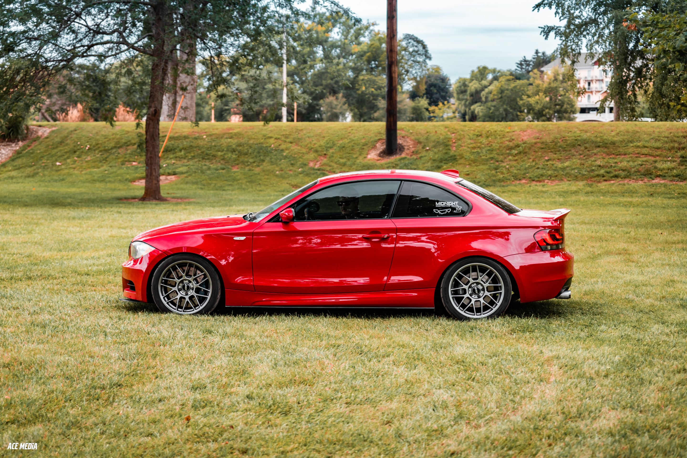 Red BMW E82 Coupe 1 Series with 18" ARC-8 Apex wheels in Hyper Black