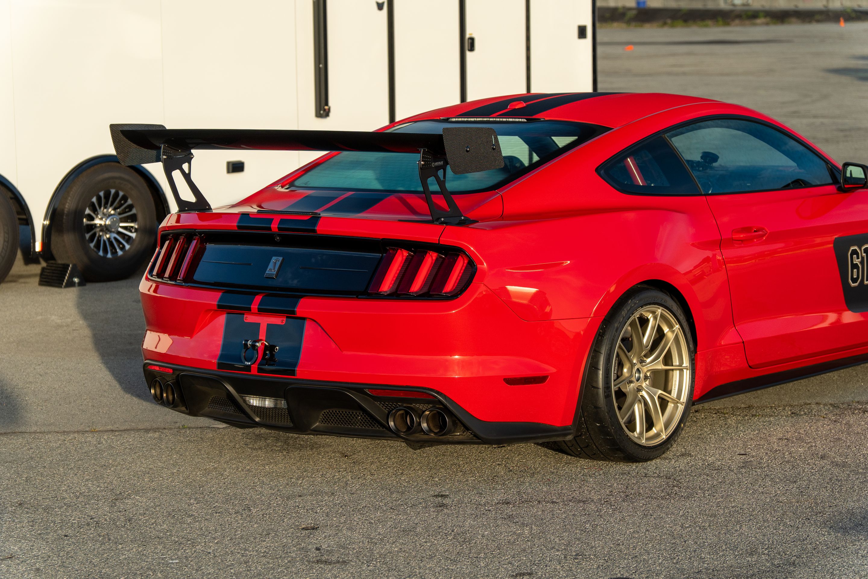 Red Ford S550 Mustang GT350 with 19" VS-5RS Apex wheels in Motorsport Gold