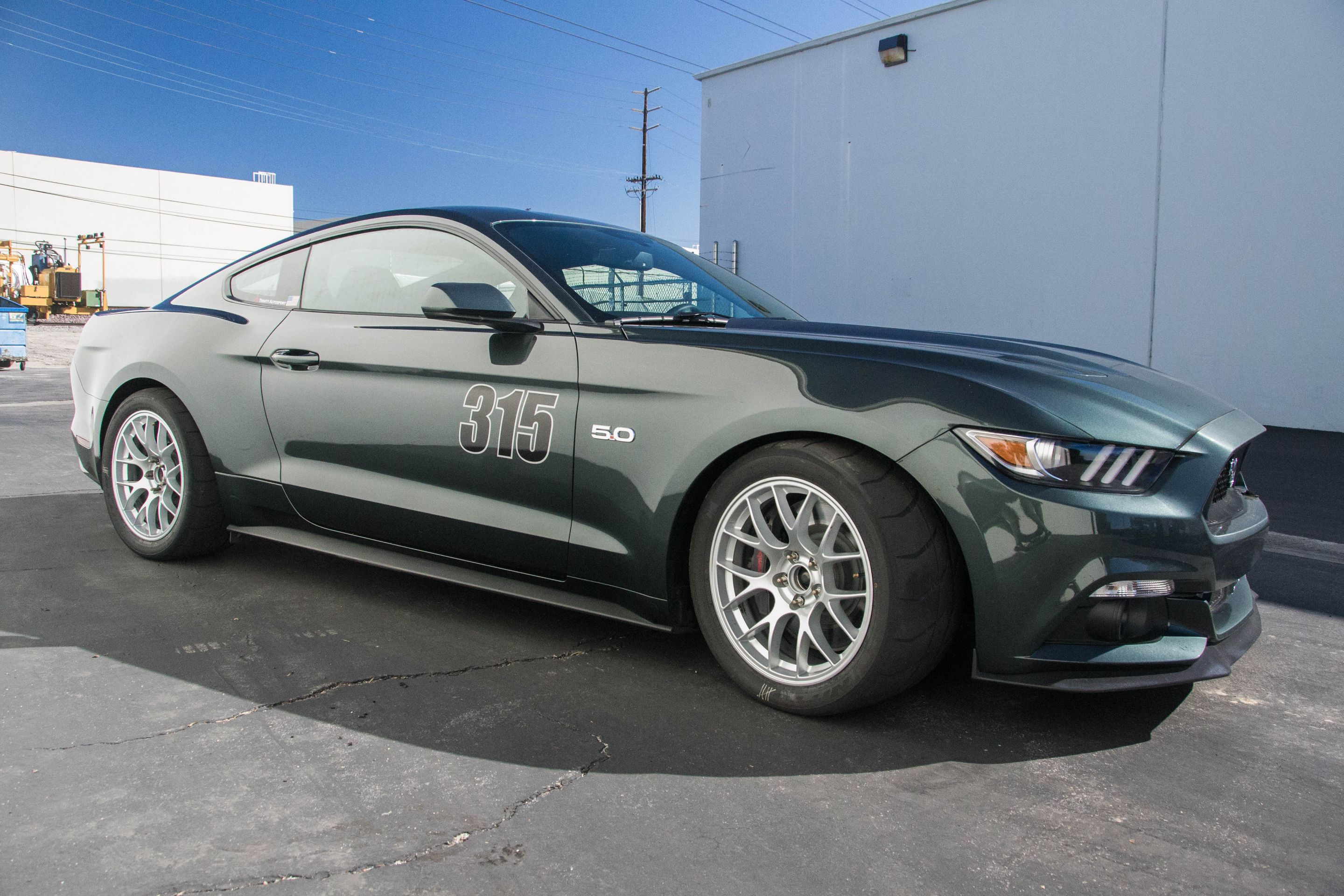 Green Ford S550 Mustang GT with 18" EC-7 Apex wheels in Race Silver