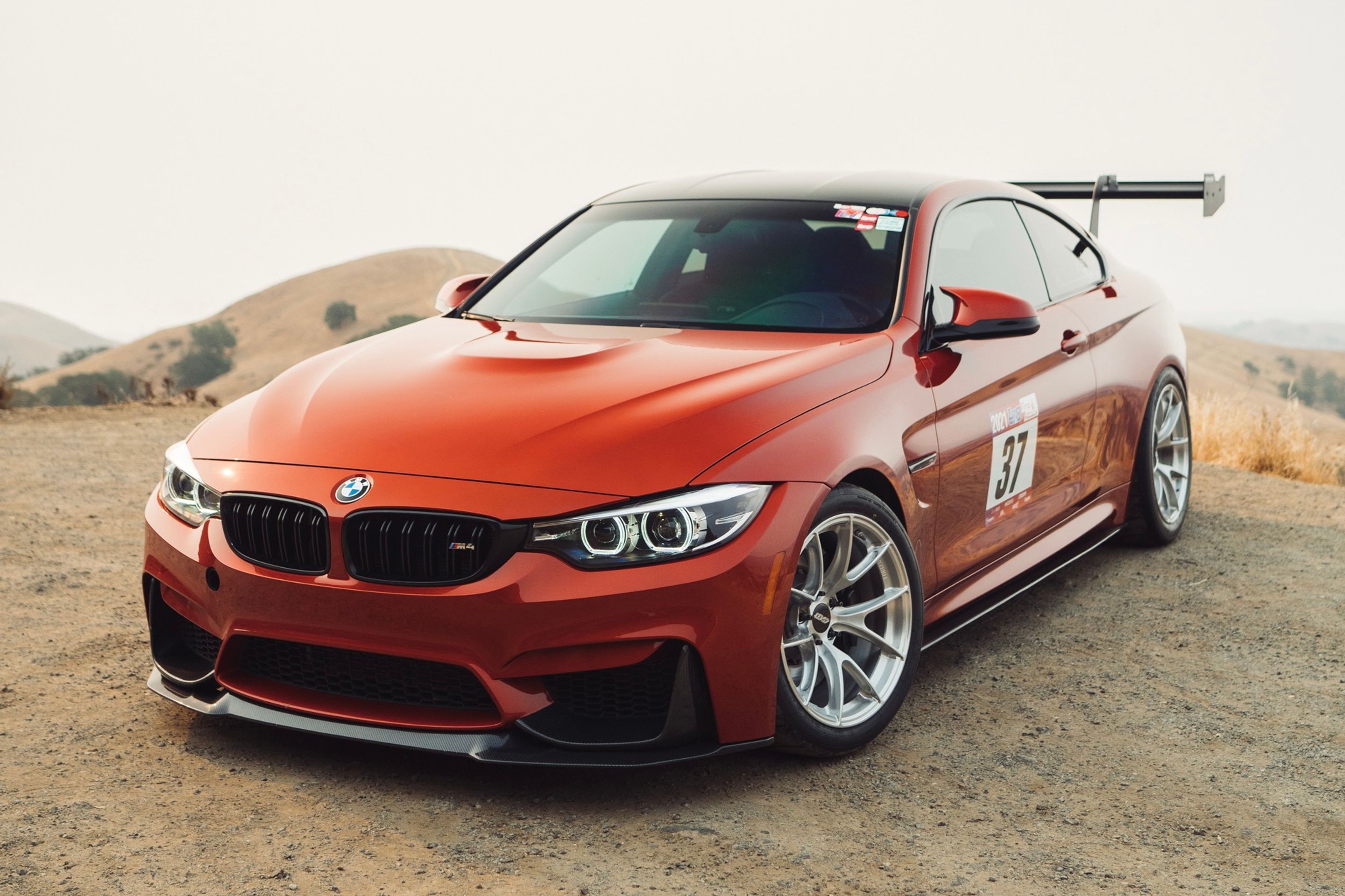 Orange BMW F82 Coupe M4 with 18" VS-5RS Apex wheels in Brushed Clear