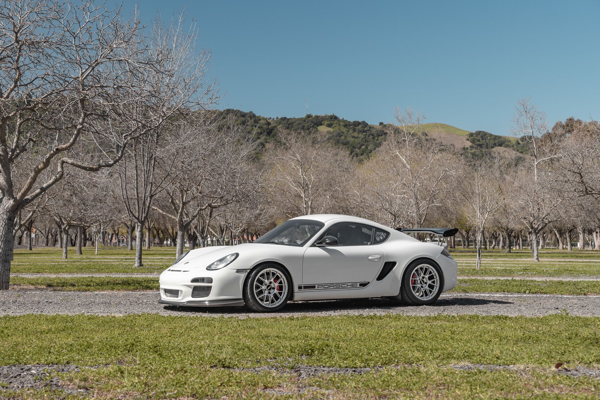 White Porsche 987 Cayman R with 18" EC-7RS Apex wheels in Race Silver