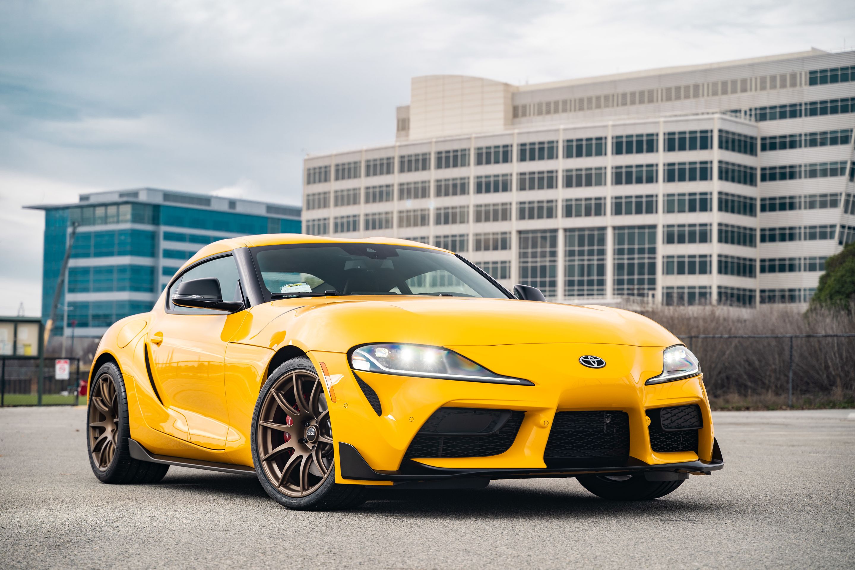 Yellow Toyota GR Supra with 19" SM-10 Apex wheels in Satin Bronze