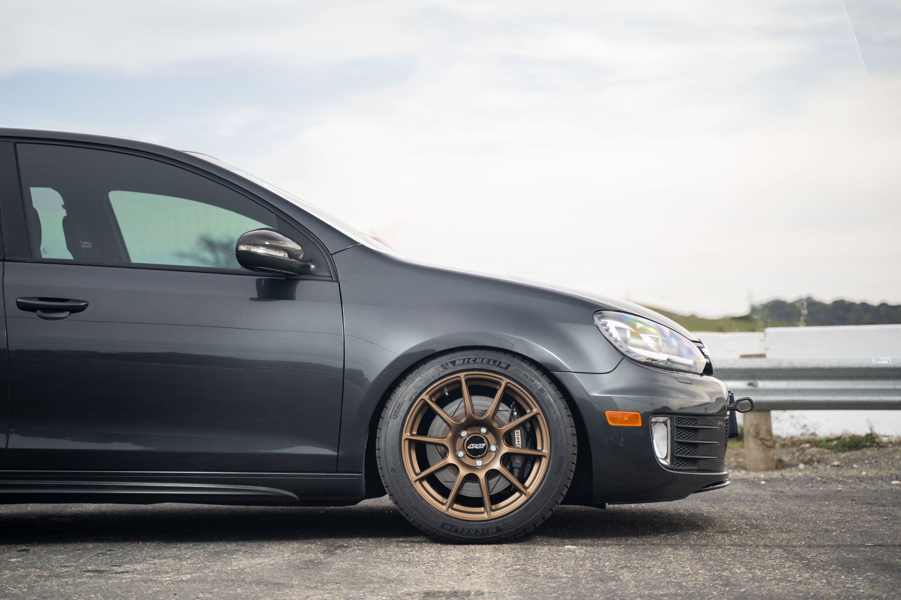 Grey VW MK6 GTI with 17" SM-10 Apex wheels in Satin Bronze