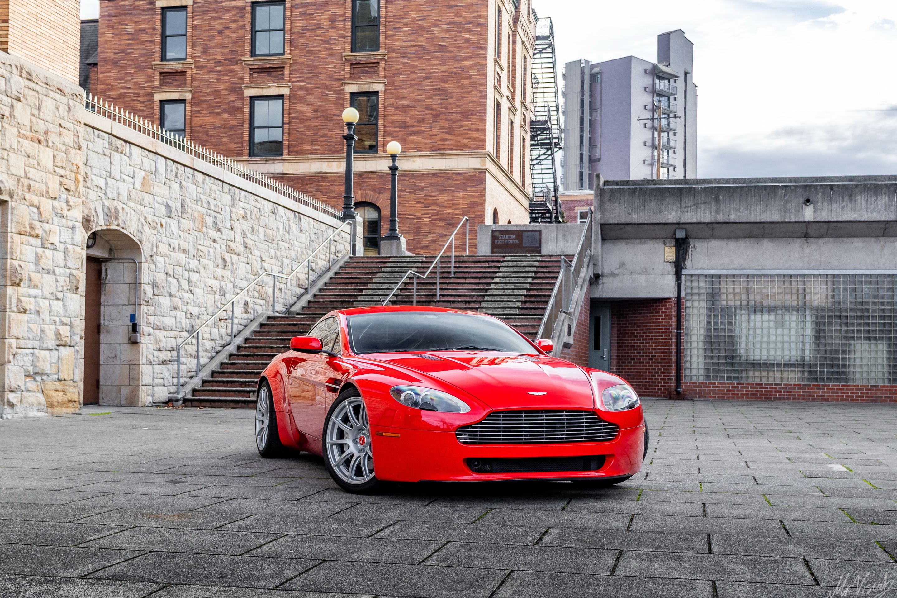 Red Aston Martin V8/V12 Vantage with 19" SM-10 Apex wheels in Race Silver