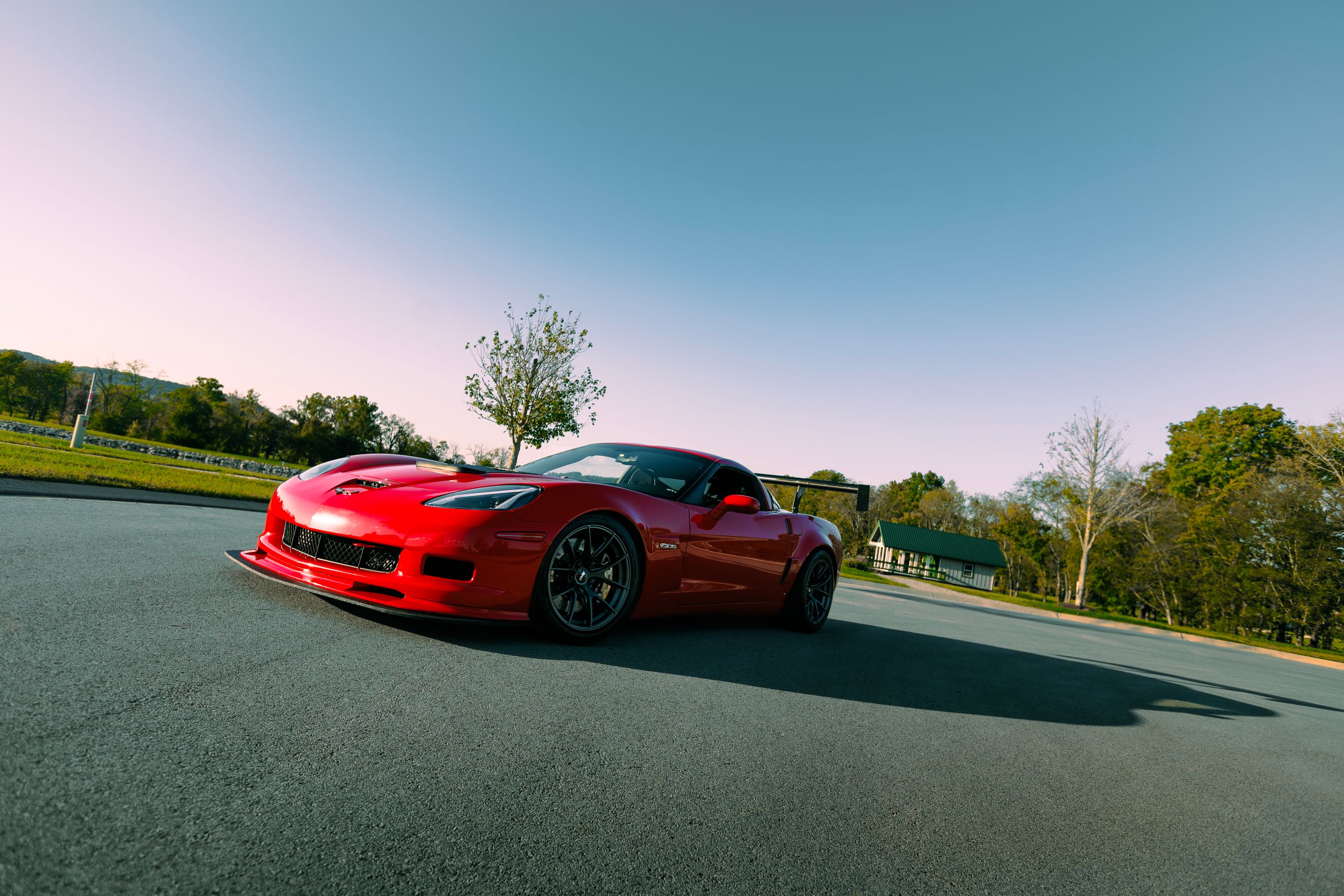 Red Chevrolet C6 Corvette Z06 with 18" VS-5RS Apex wheels in Anthracite
