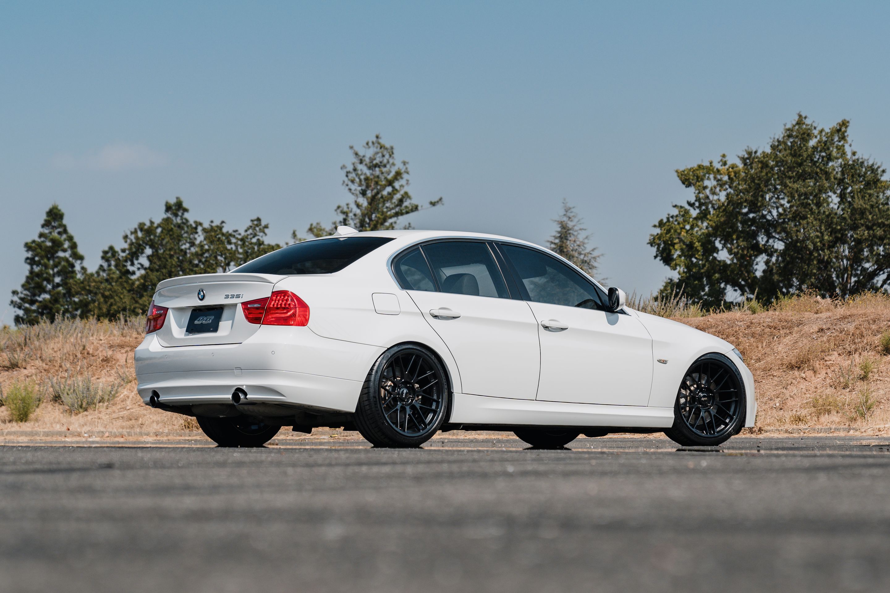 White BMW E90 LCI Sedan 3 Series with 19" ARC-8RT Apex wheels in Satin Black